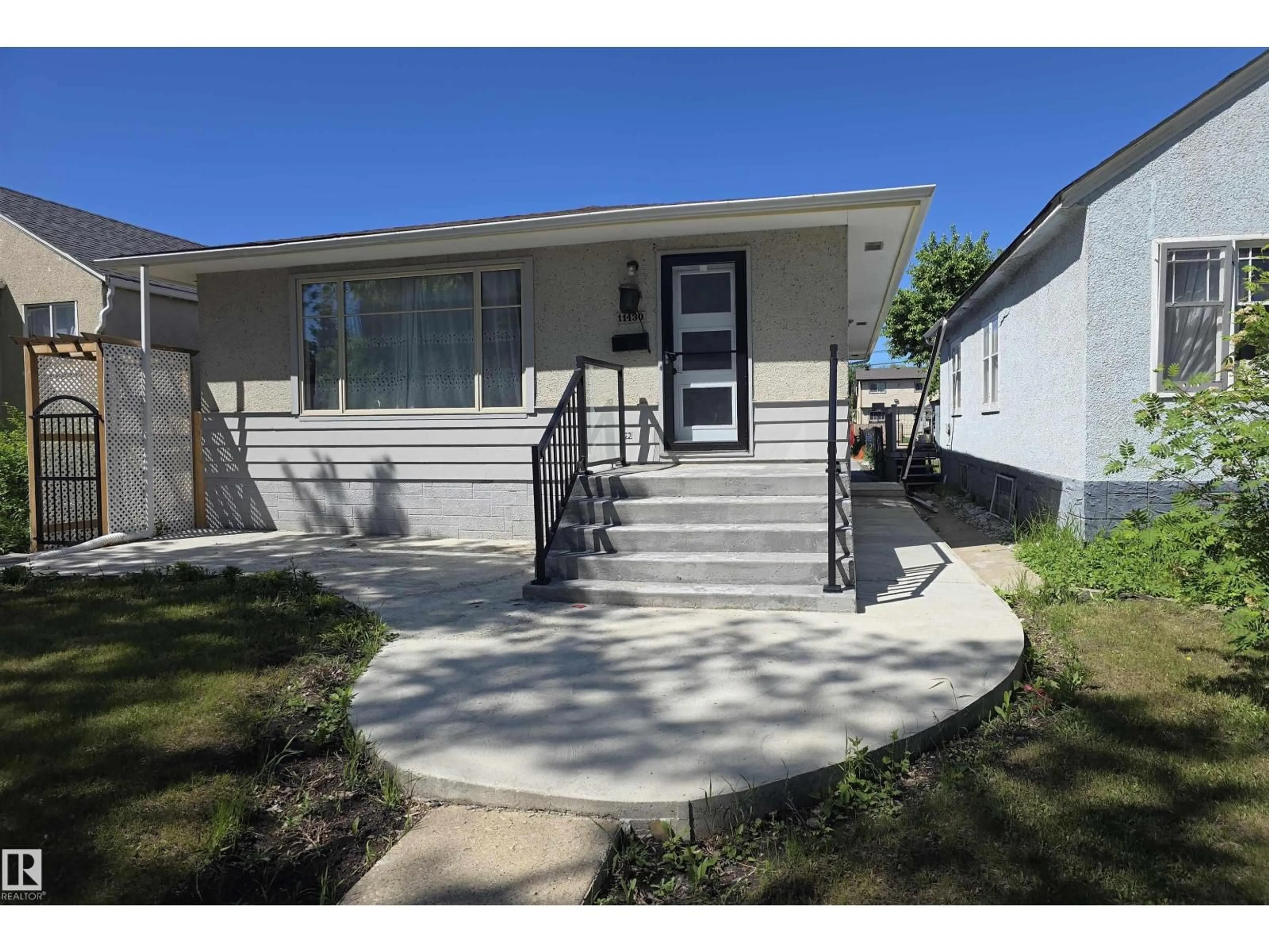 Home with vinyl exterior material, street for NW - 11430 81 ST, Edmonton Alberta T5B2R6