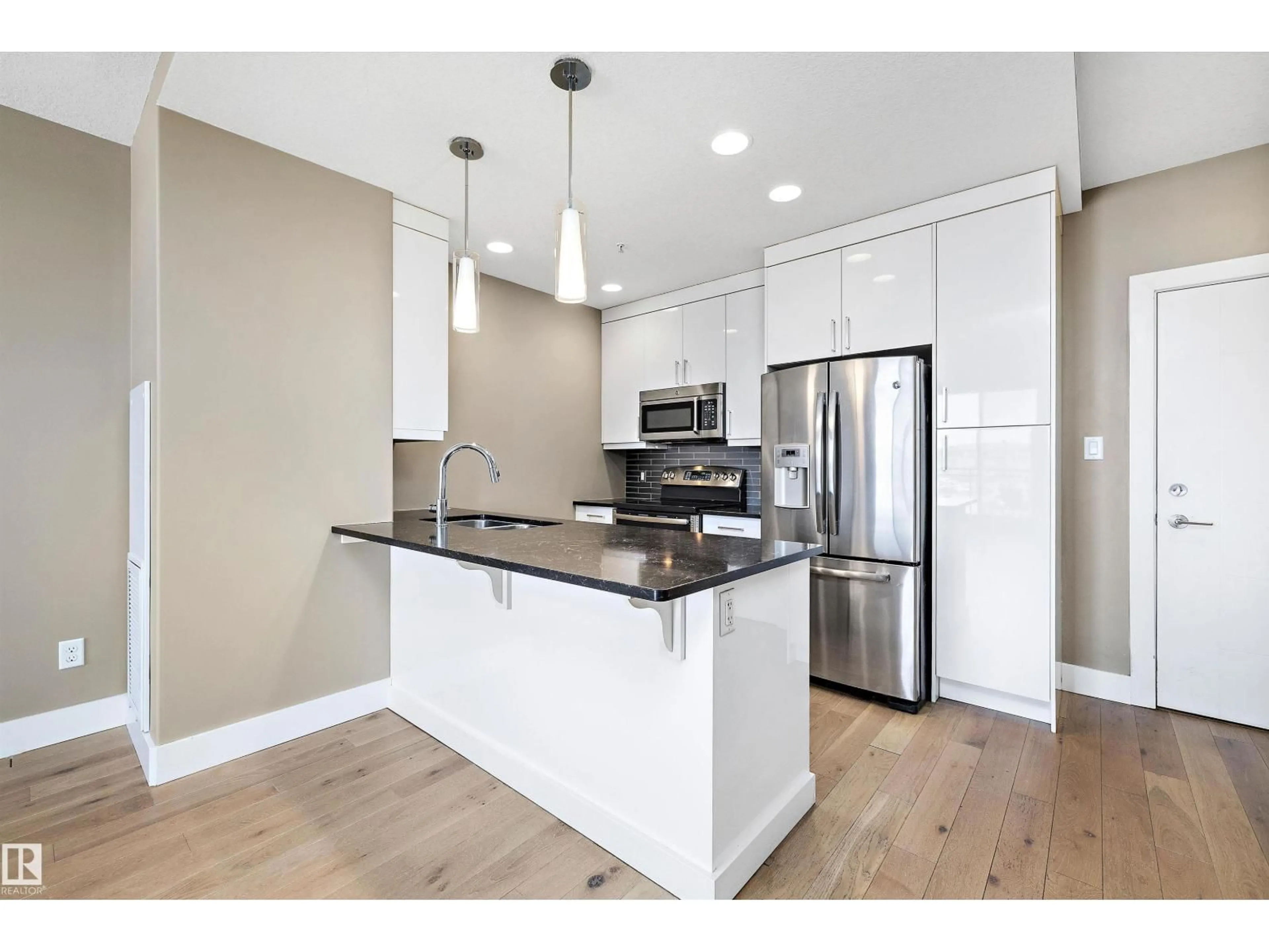 Open concept kitchen, wood/laminate floor for 307 - 11080 ELLERSLIE RD SW, Edmonton Alberta T6W2C2