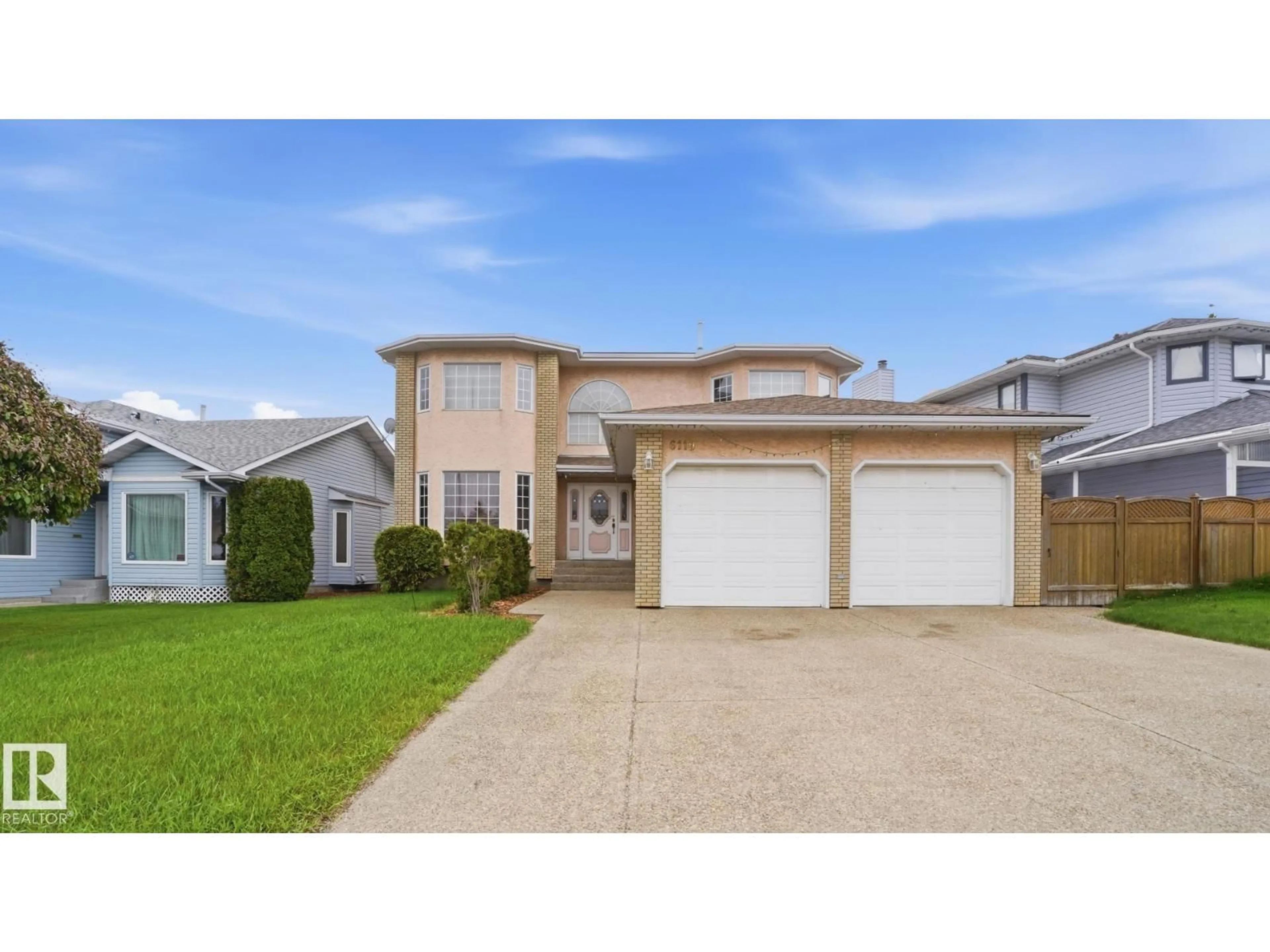 Home with vinyl exterior material, street for 6119 156 AV, Edmonton Alberta T5Y2N1
