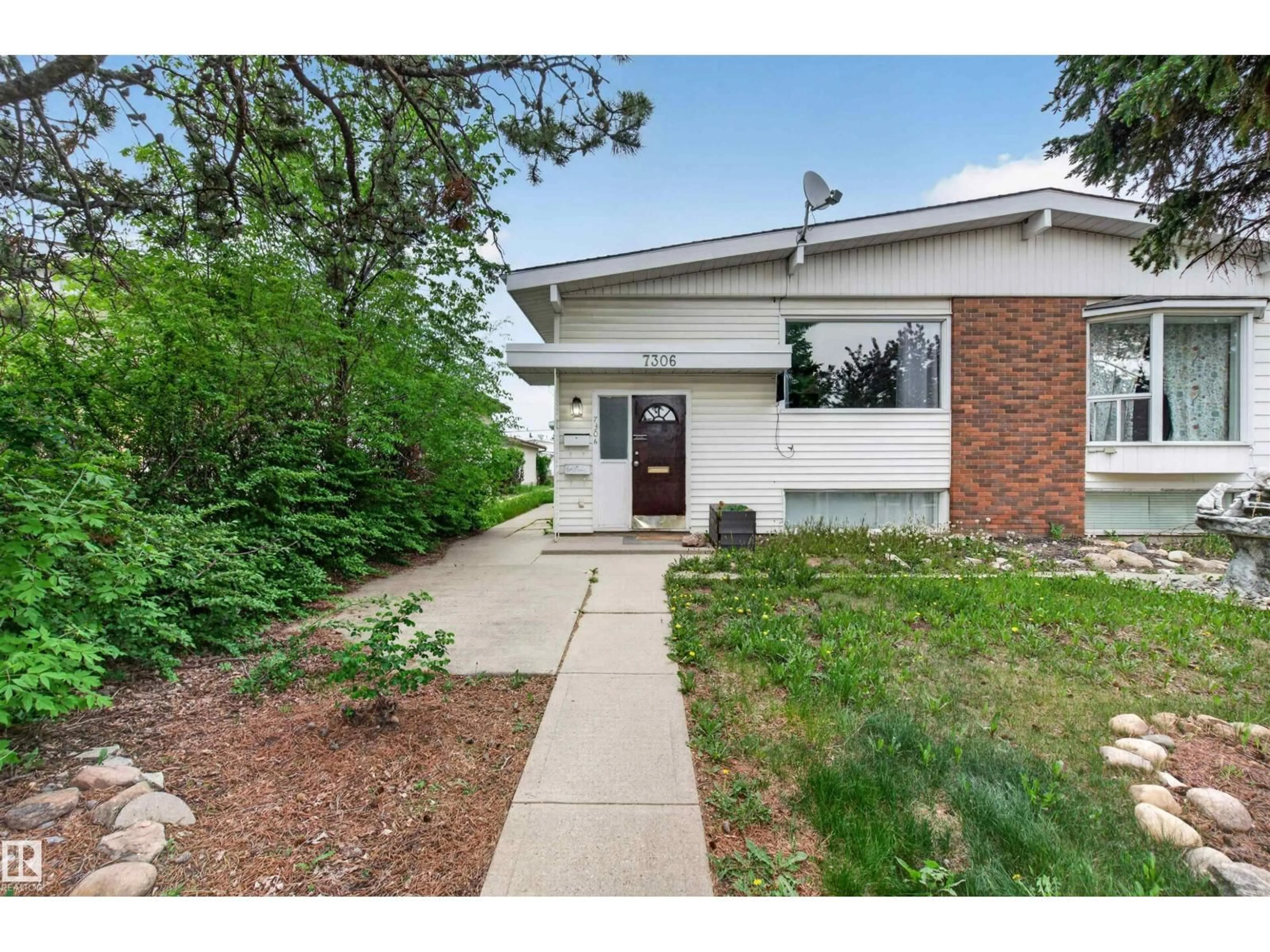 Home with brick exterior material, street for 7304/7306 78 AV, Edmonton Alberta T6B0C1