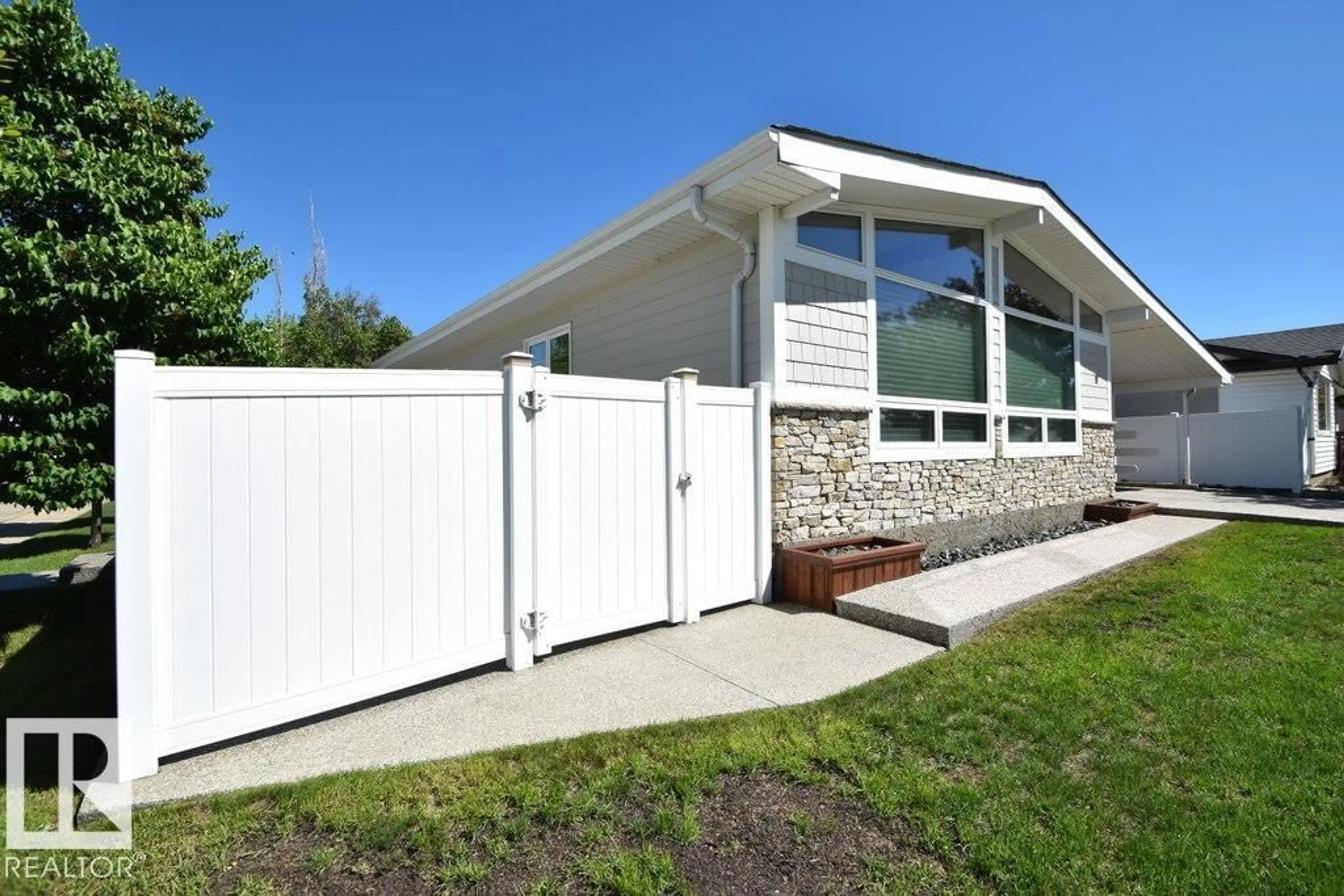 Home with vinyl exterior material, street for 9212 132A AV NW, Edmonton Alberta T5E1B5