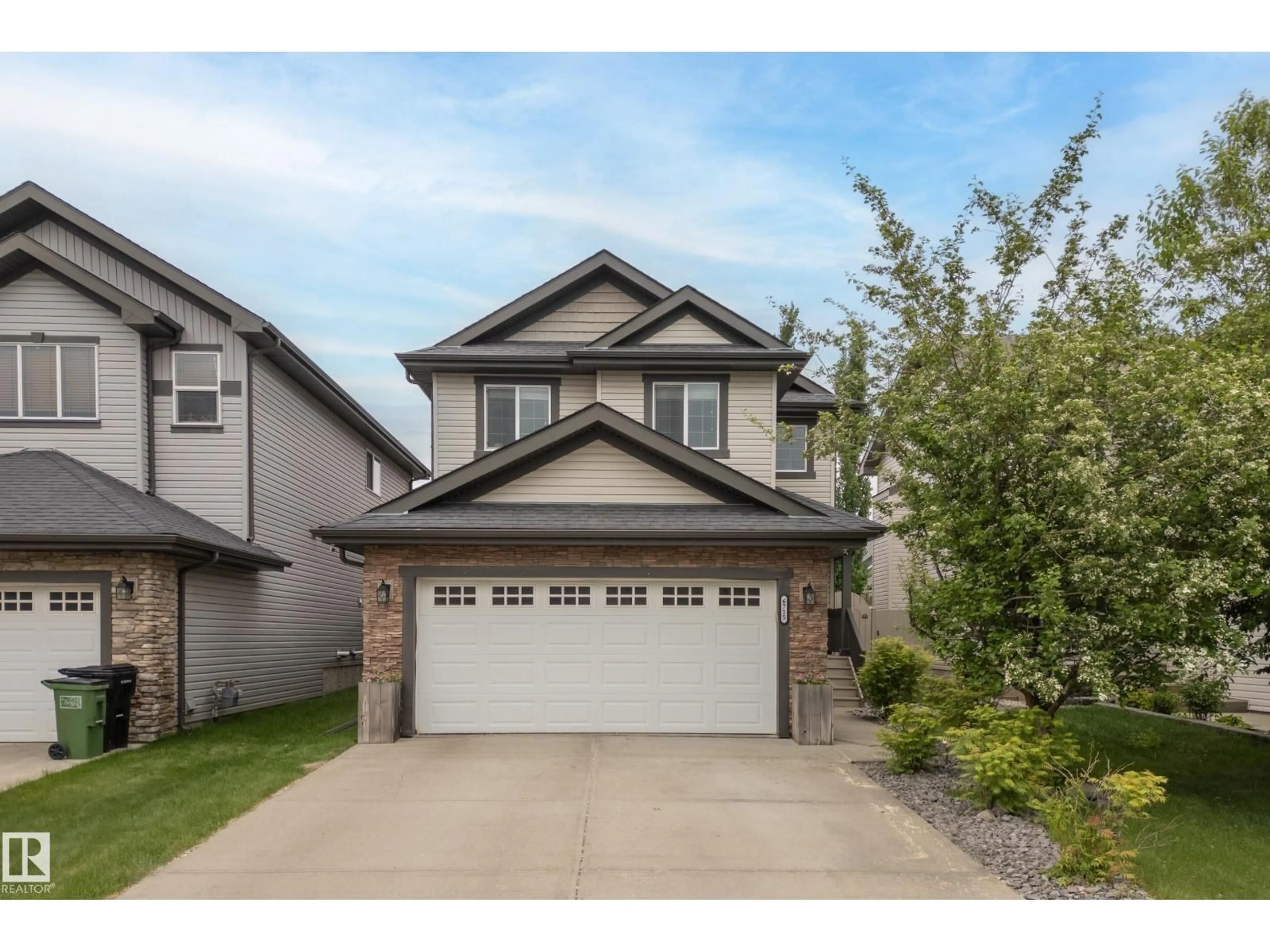 Home with vinyl exterior material, street for 6715 19 AV, Edmonton Alberta T6X0L9