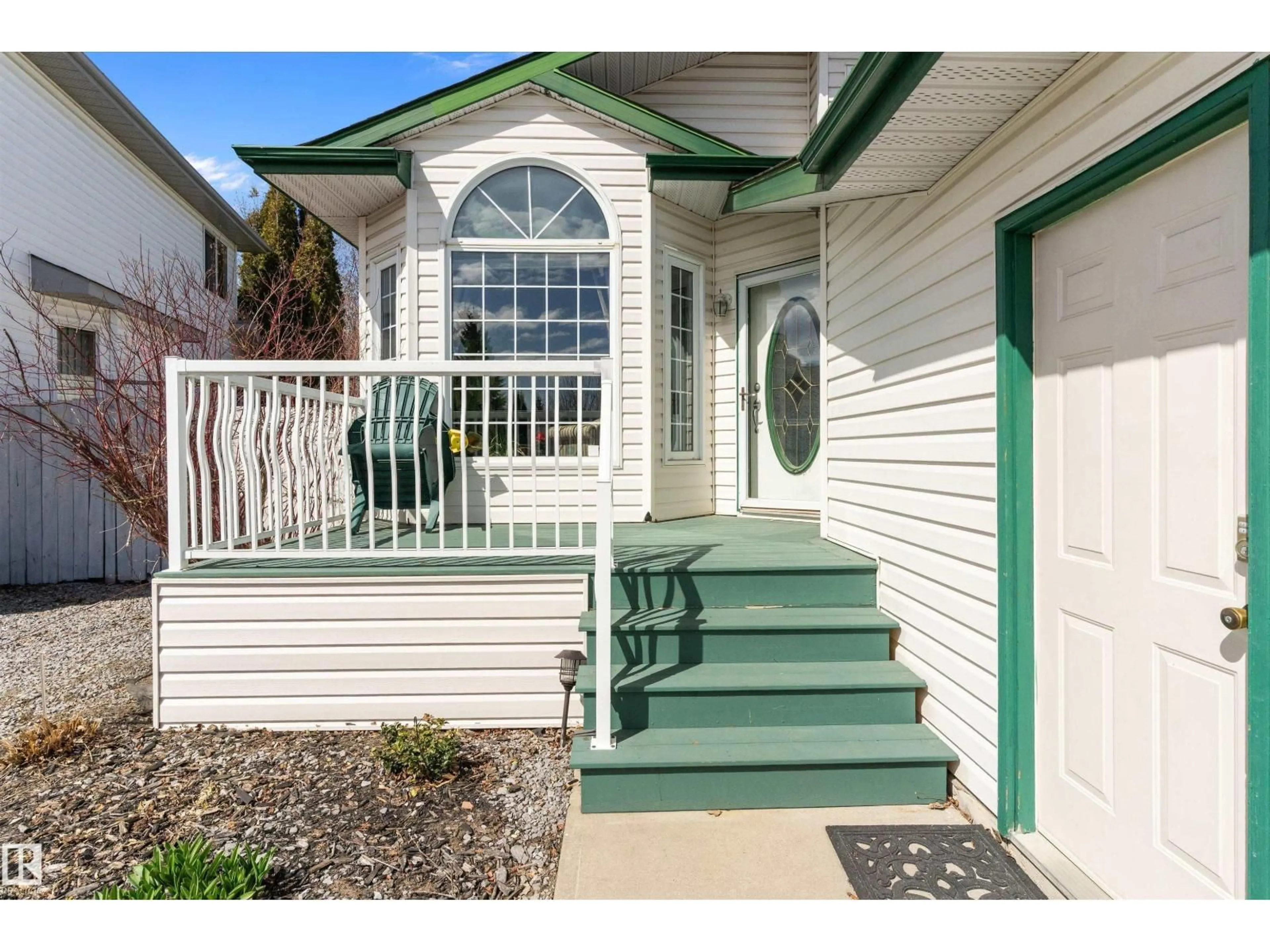 Home with vinyl exterior material, street for 11328 173 AV, Edmonton Alberta T5X5Y4