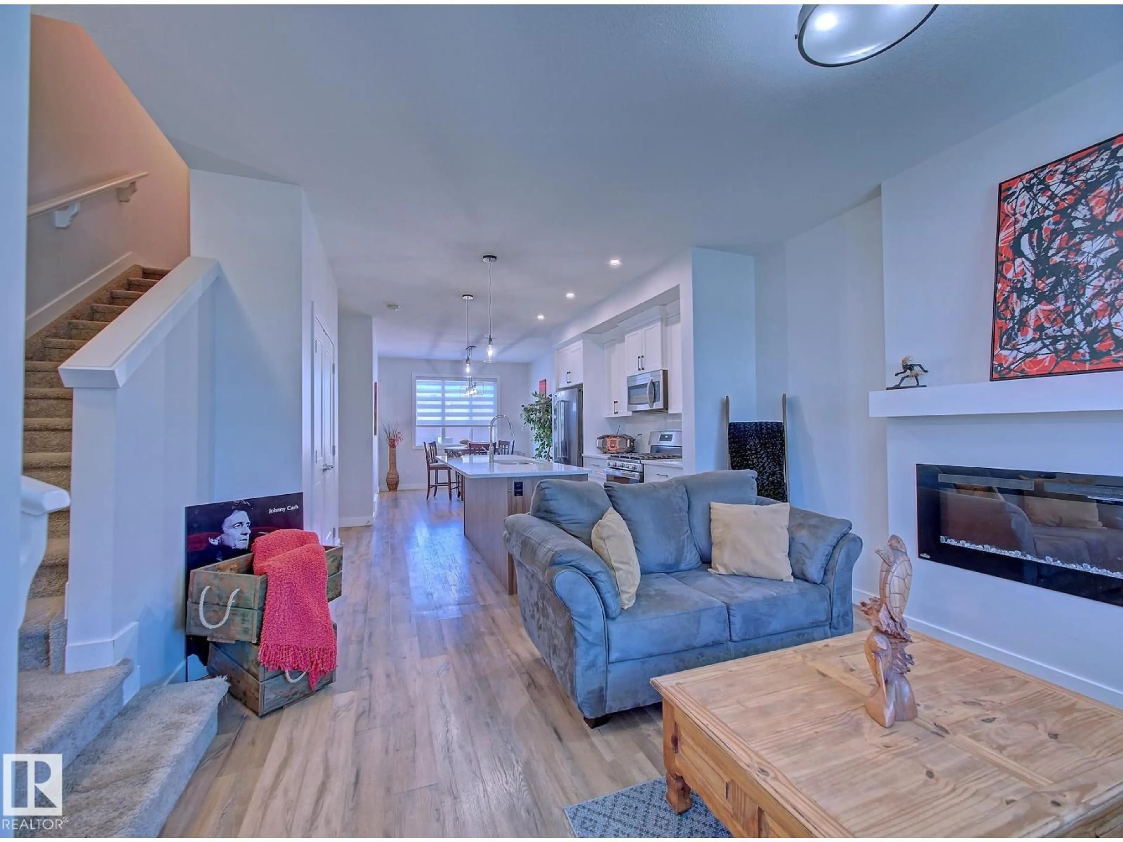 Living room with furniture, wood/laminate floor for 8503 96 AV, Morinville Alberta T8R0B8