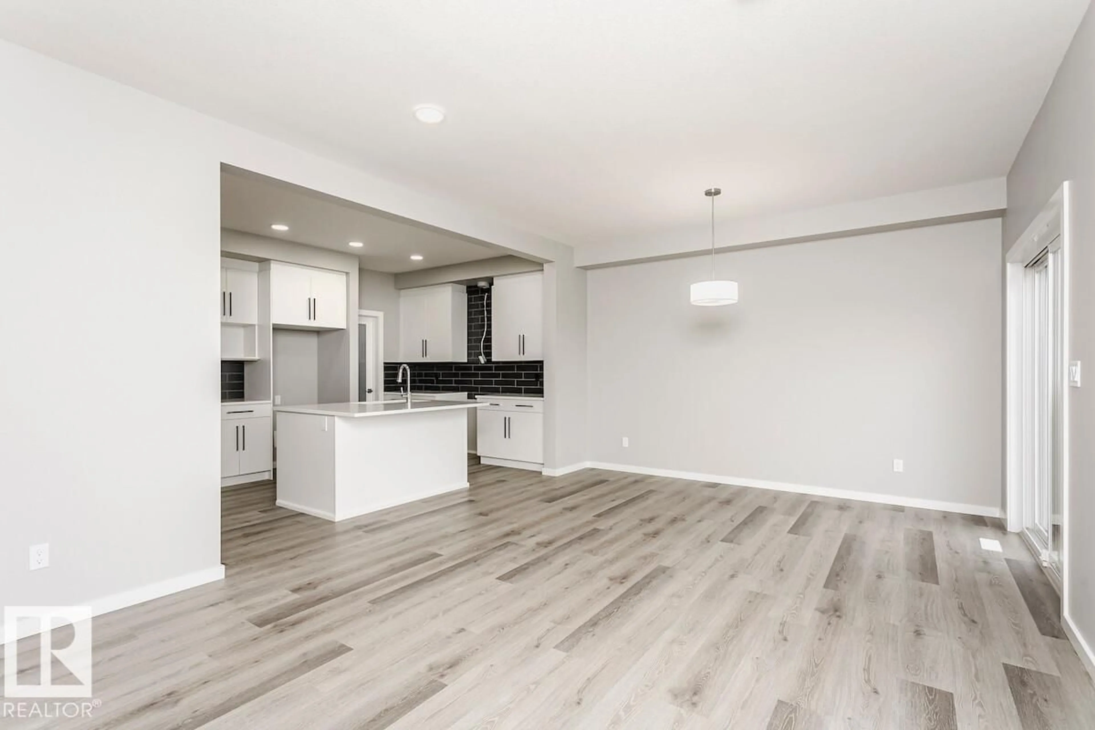Open concept kitchen, wood/laminate floor for 2480 EGRET LO, Edmonton Alberta T6M3R4