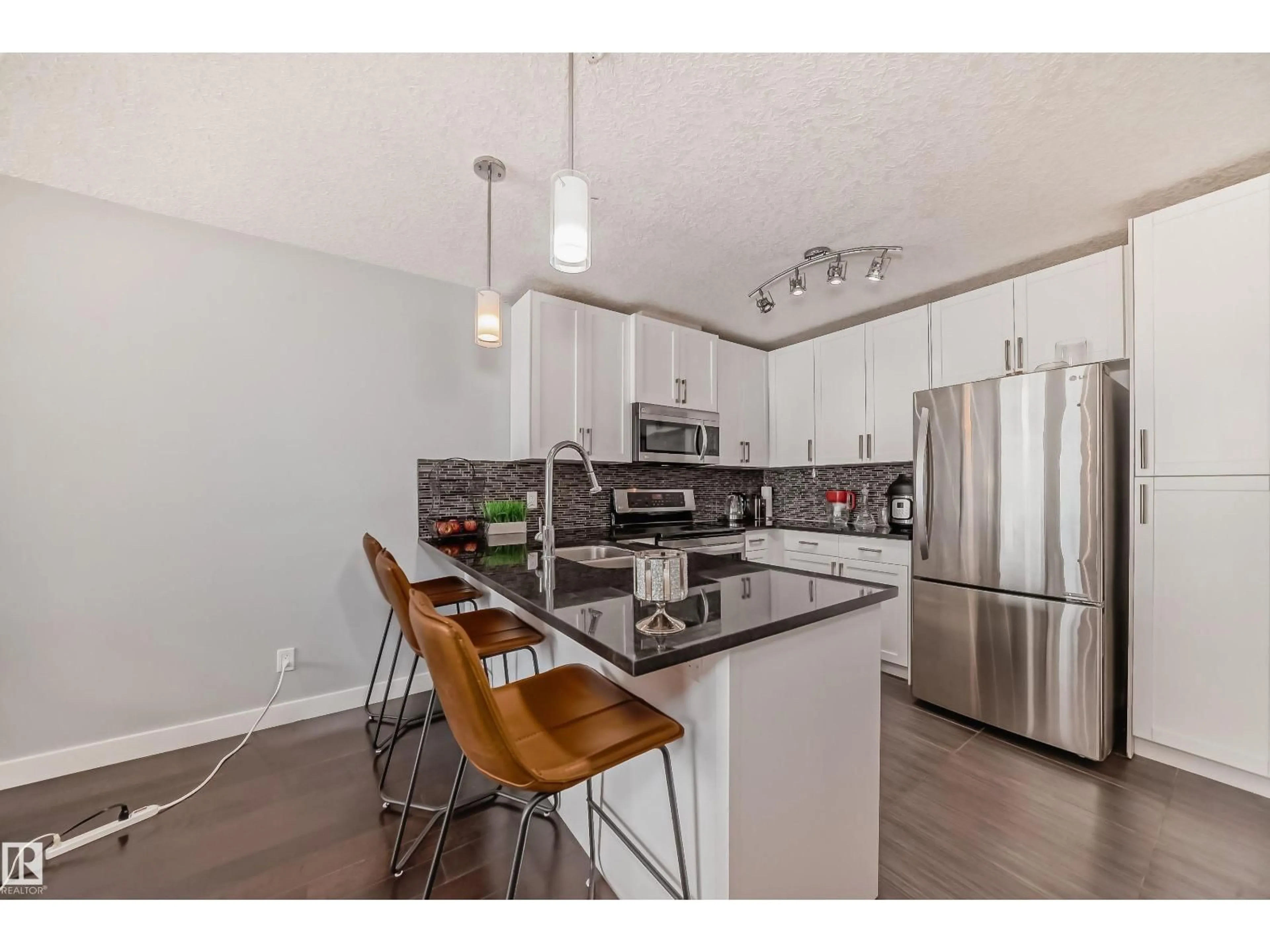 Open concept kitchen, wood/laminate floor for 5151 WINDERMERE BV, Edmonton Alberta T6W2K4
