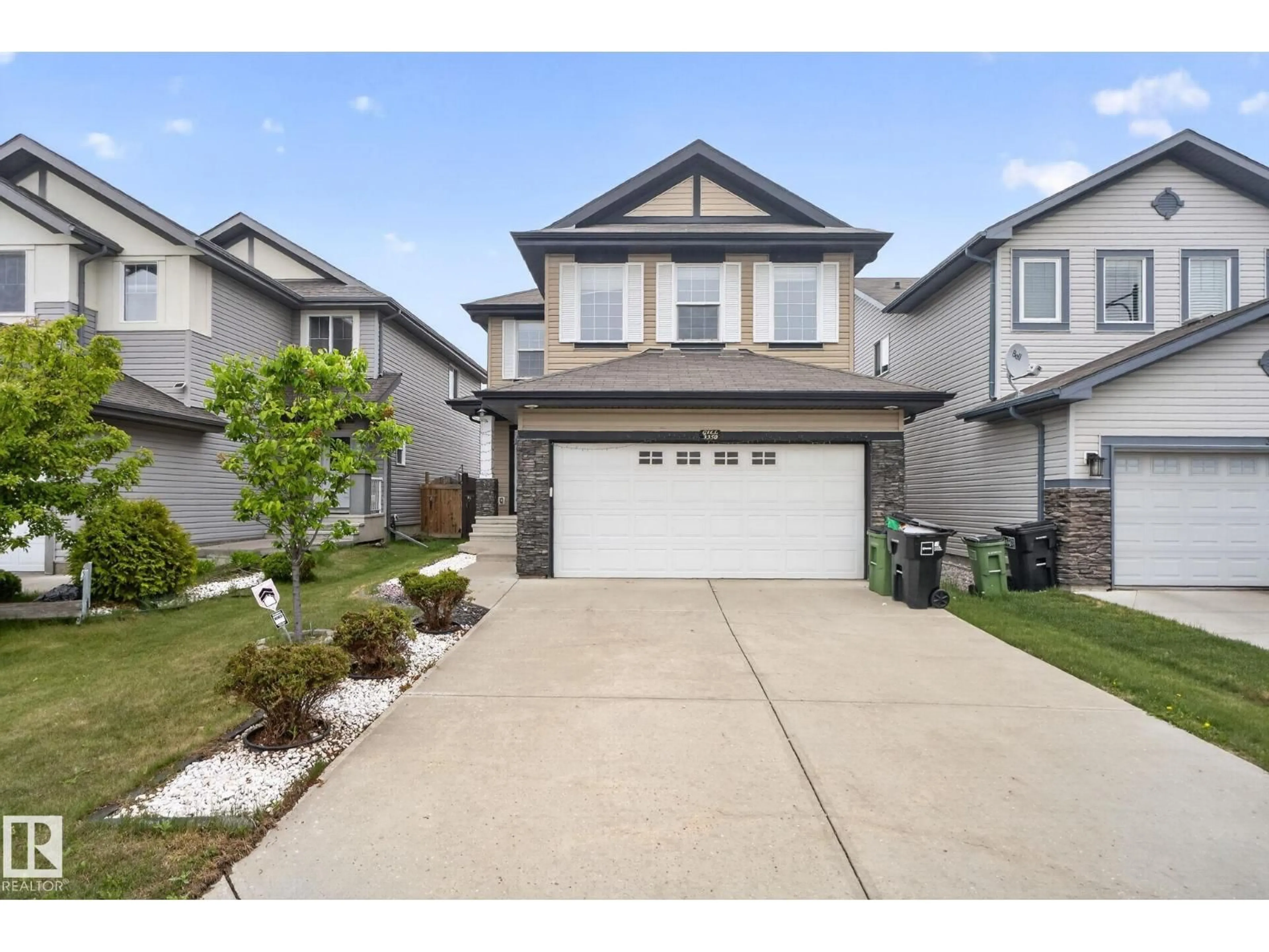 Home with vinyl exterior material, street for NW - 3350 18B ST, Edmonton Alberta T6T0R4