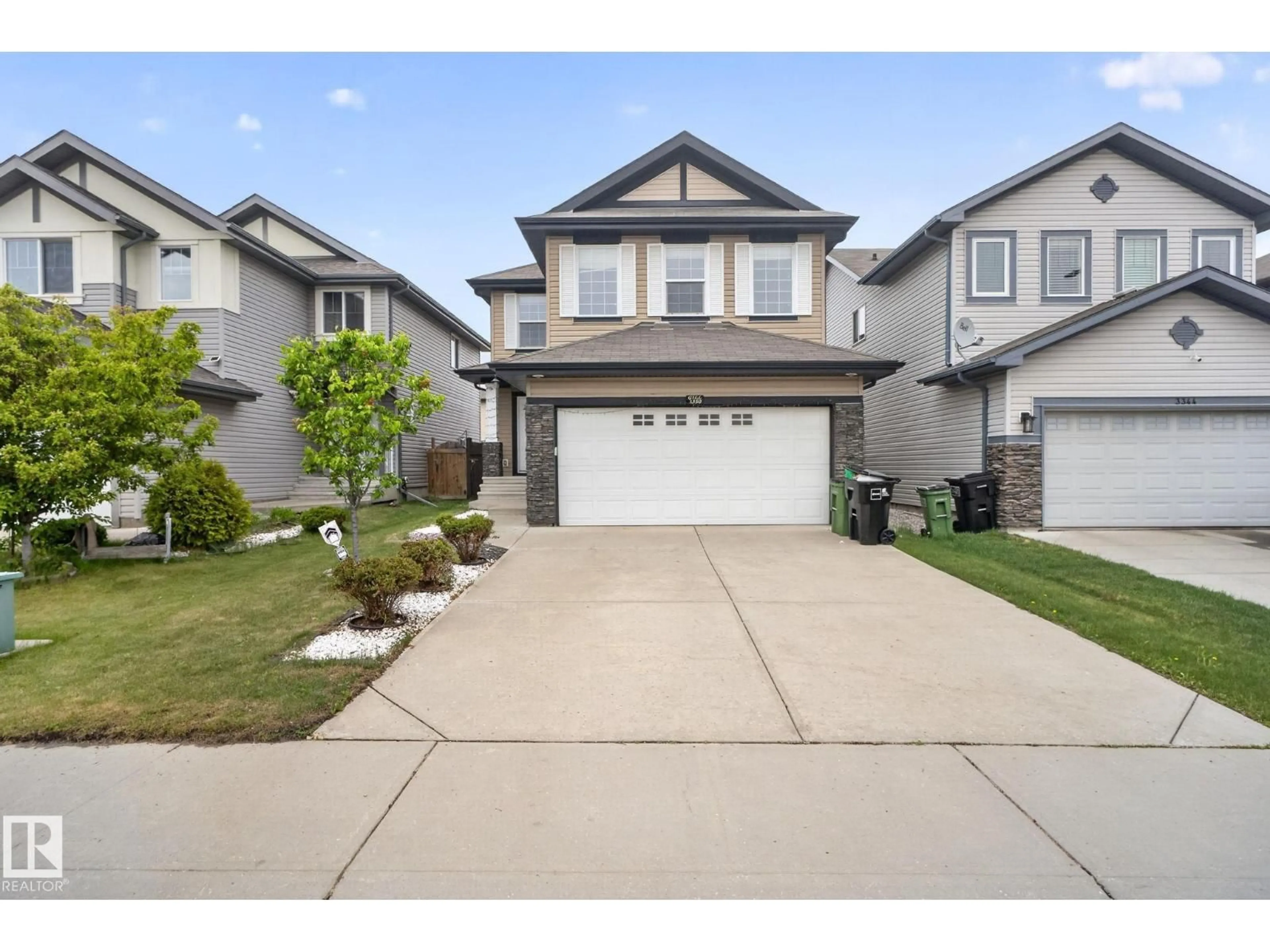 Home with vinyl exterior material, street for NW - 3350 18B ST, Edmonton Alberta T6T0R4