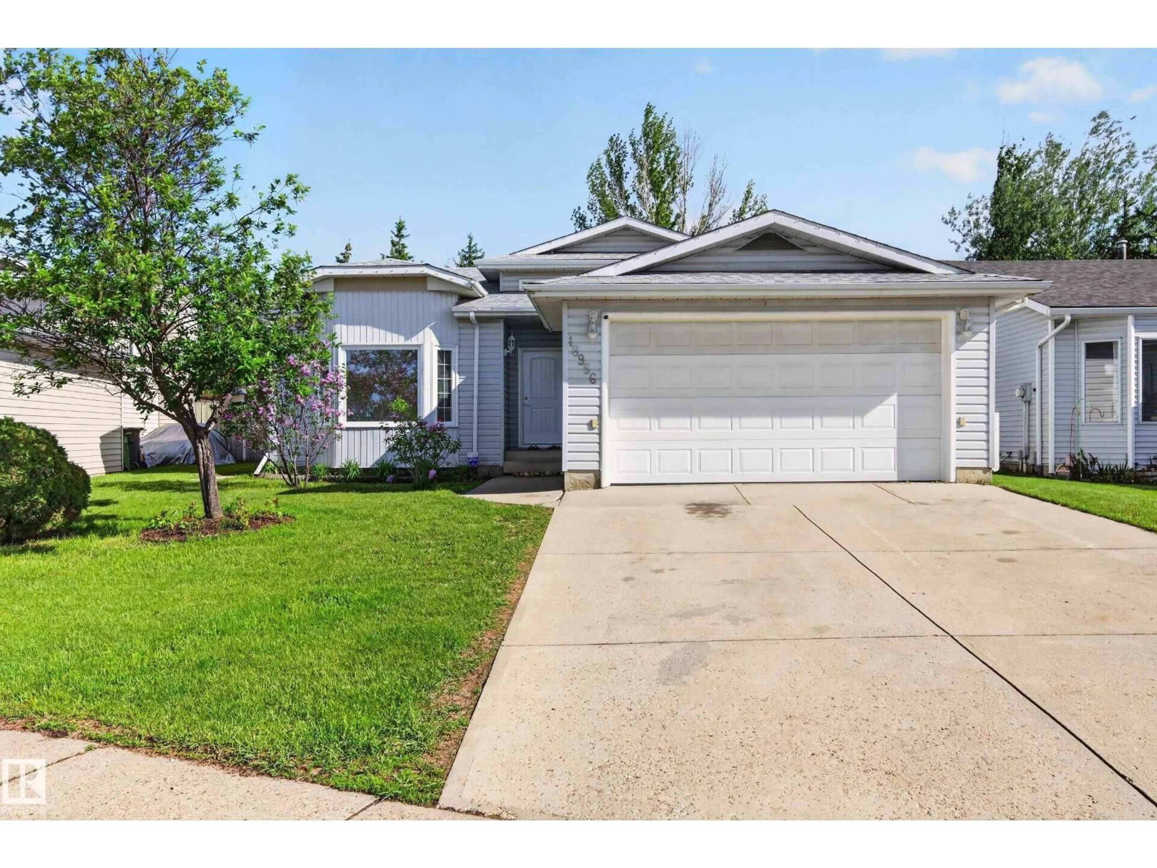 Home with vinyl exterior material, street for 18956 78 AV, Edmonton Alberta T5T5H7