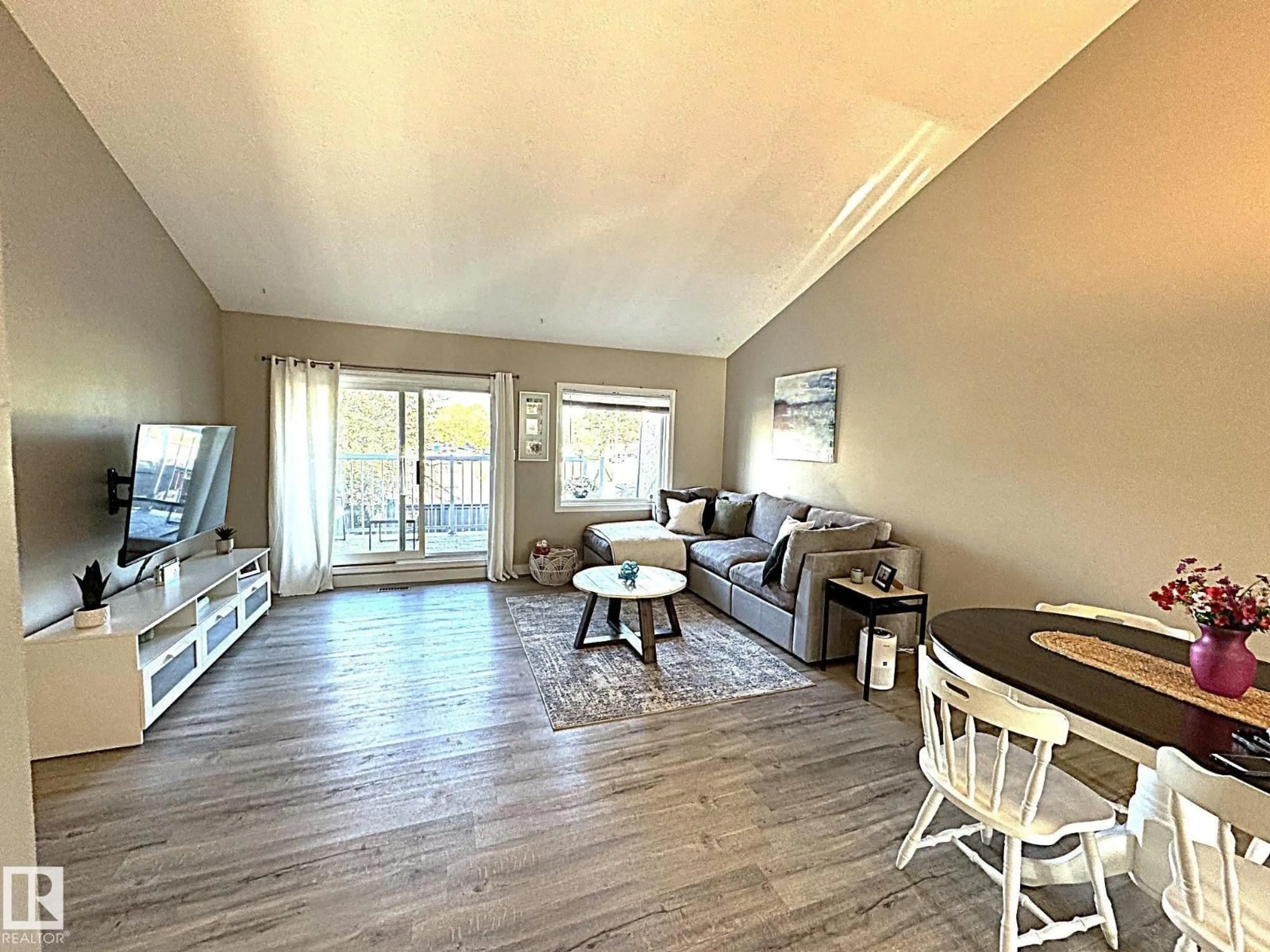 Living room with furniture, wood/laminate floor for 3 - 6220 172 ST, Edmonton Alberta T5T3R4