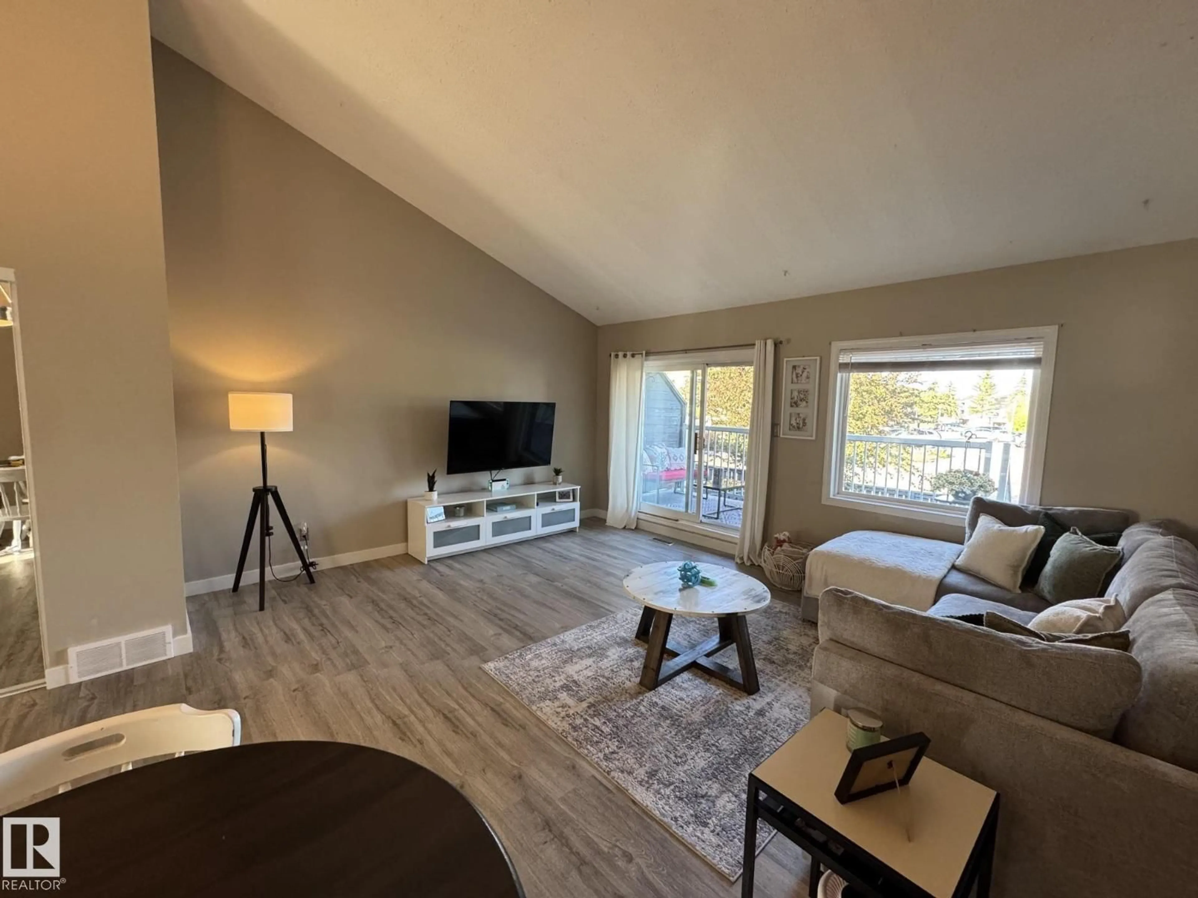 Living room with furniture, wood/laminate floor for 3 - 6220 172 ST, Edmonton Alberta T5T3R4