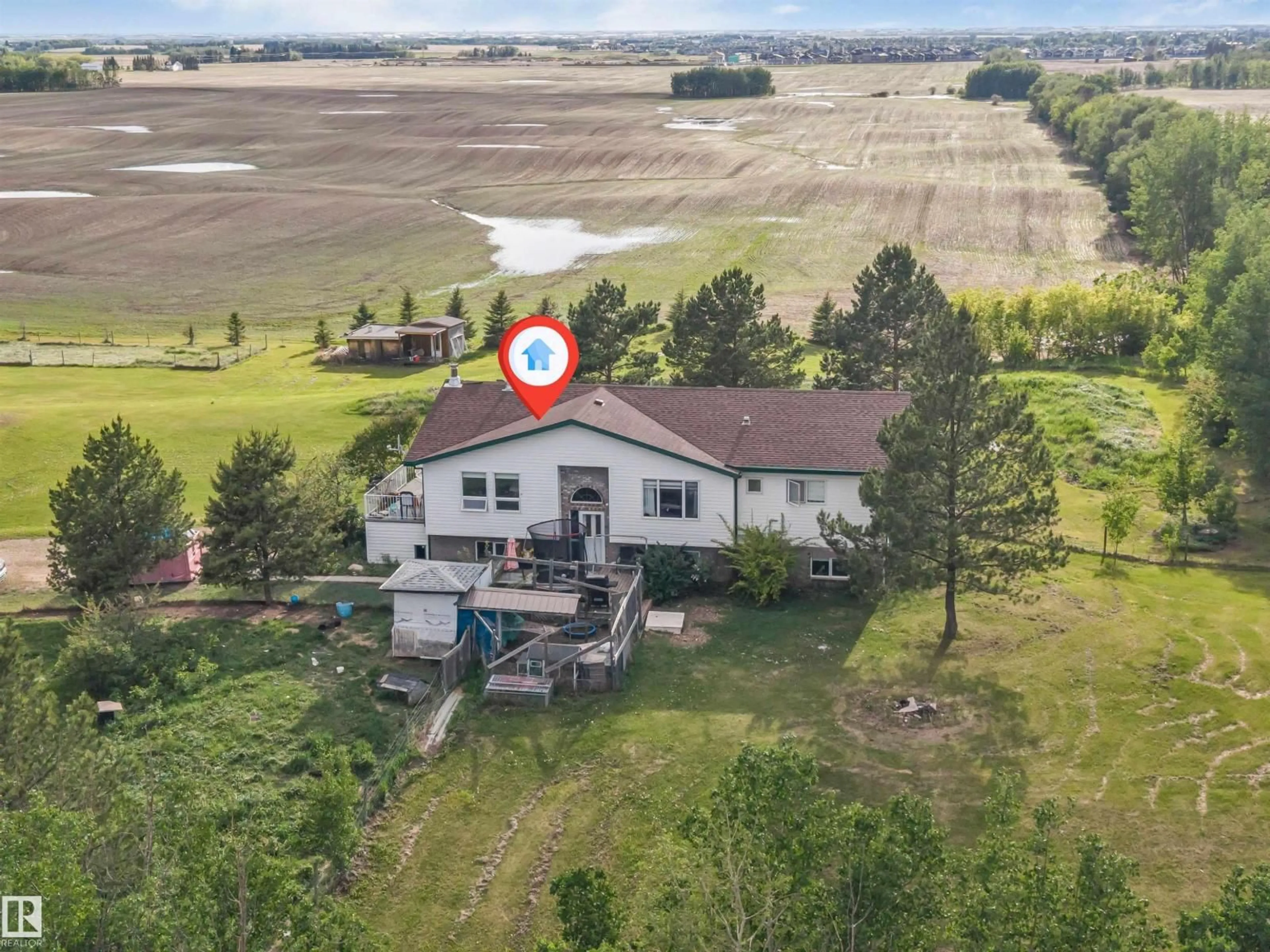 A pic from outside/outdoor area/front of a property/back of a property/a pic from drone, water/lake/river/ocean view for 50436 RGE RD 220, Rural Leduc County Alberta T4X0M6
