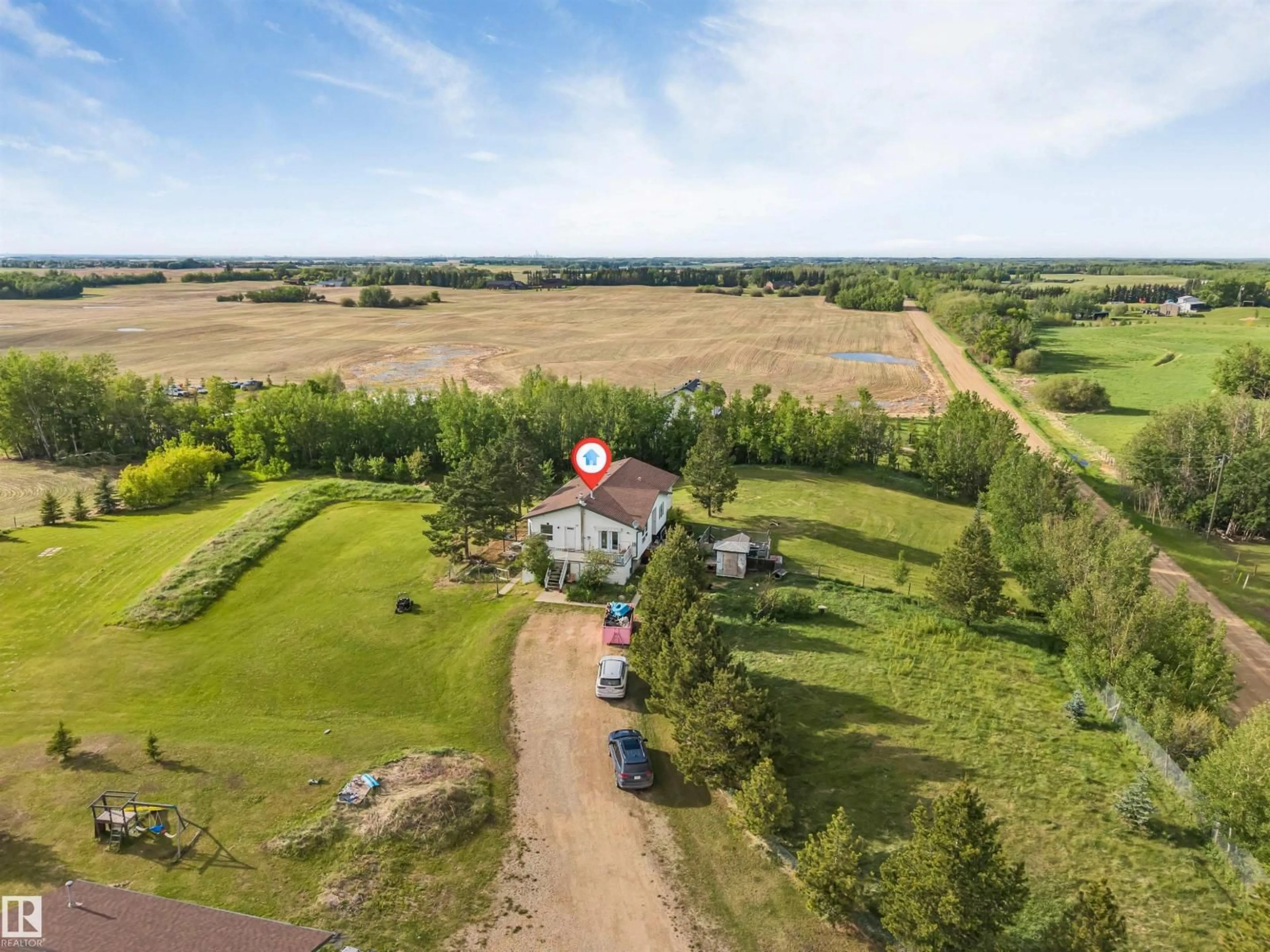 A pic from outside/outdoor area/front of a property/back of a property/a pic from drone, unknown for 50436 RGE RD 220, Rural Leduc County Alberta T4X0M6