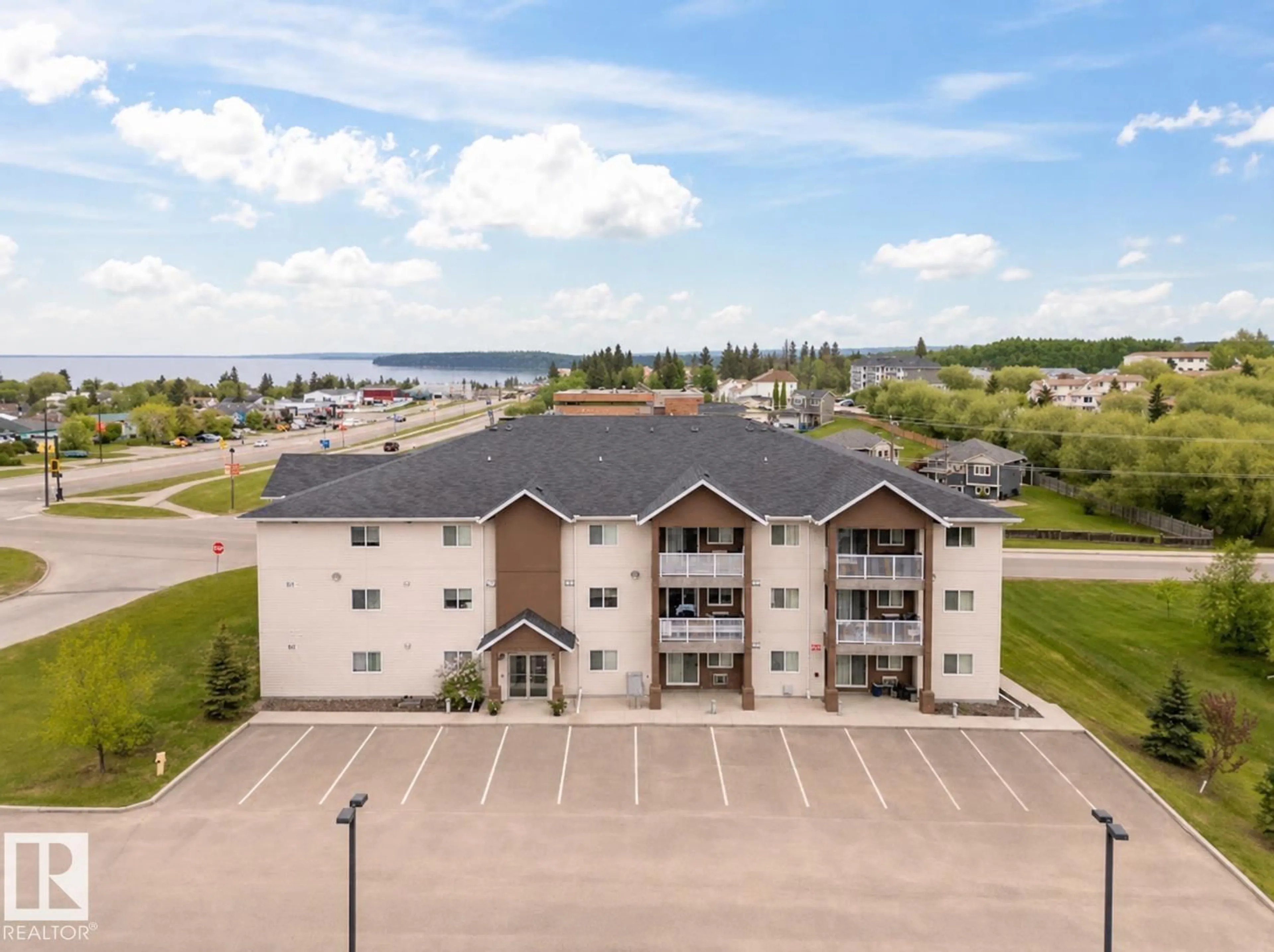 A pic from outside/outdoor area/front of a property/back of a property/a pic from drone, water/lake/river/ocean view for 1601 - 1302 8 AV, Cold Lake Alberta T9M0C3