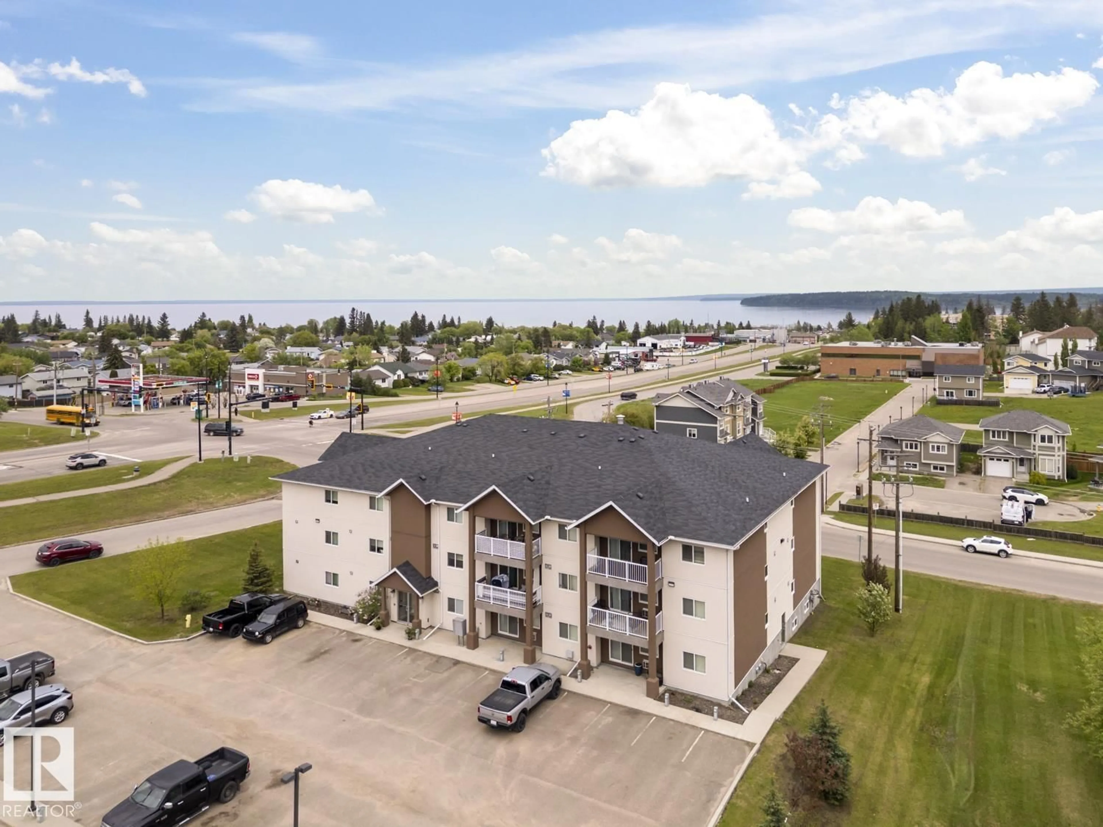 A pic from outside/outdoor area/front of a property/back of a property/a pic from drone, water/lake/river/ocean view for 1601 - 1302 8 AV, Cold Lake Alberta T9M0C3