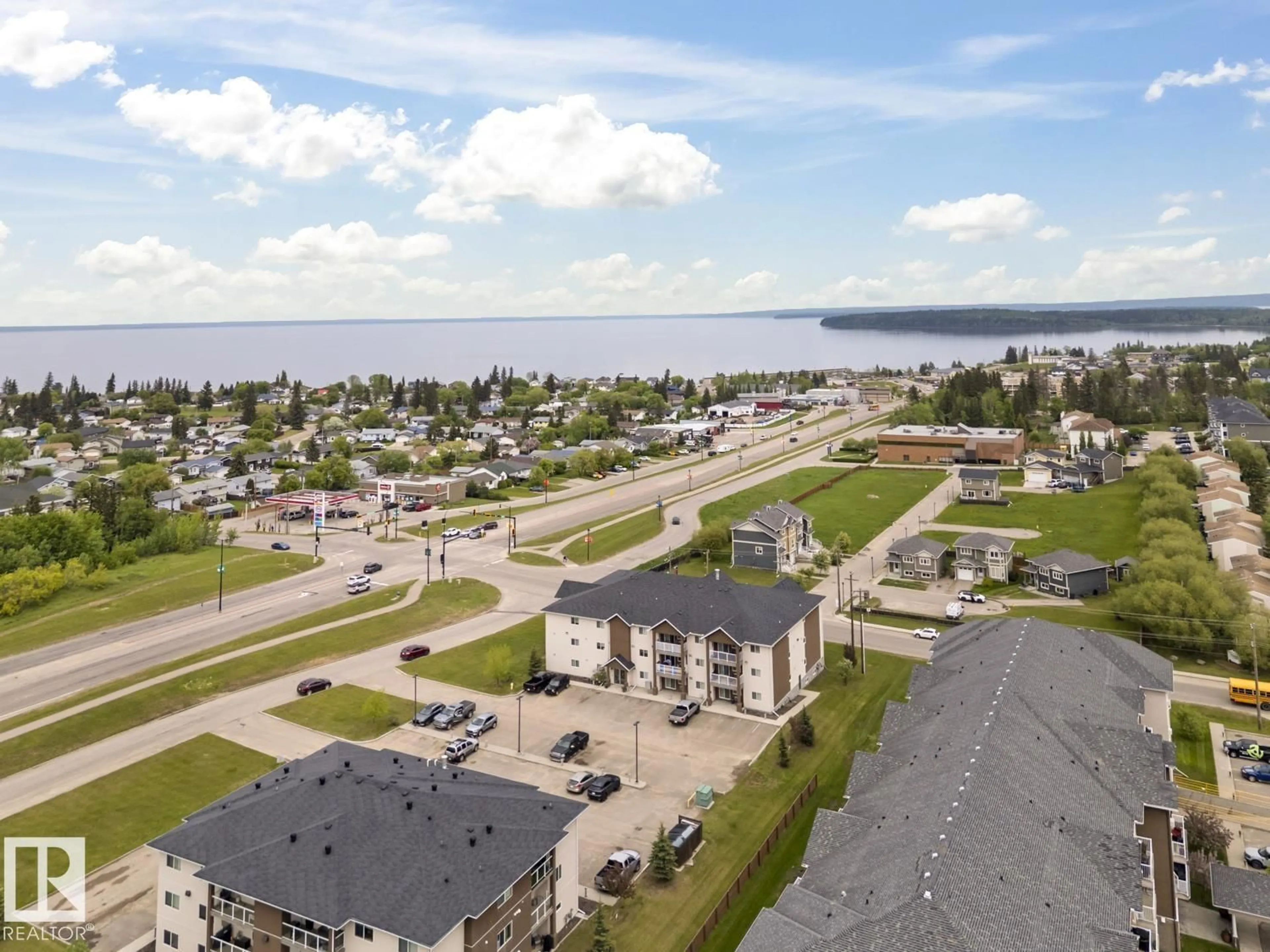 A pic from outside/outdoor area/front of a property/back of a property/a pic from drone, water/lake/river/ocean view for 1601 - 1302 8 AV, Cold Lake Alberta T9M0C3