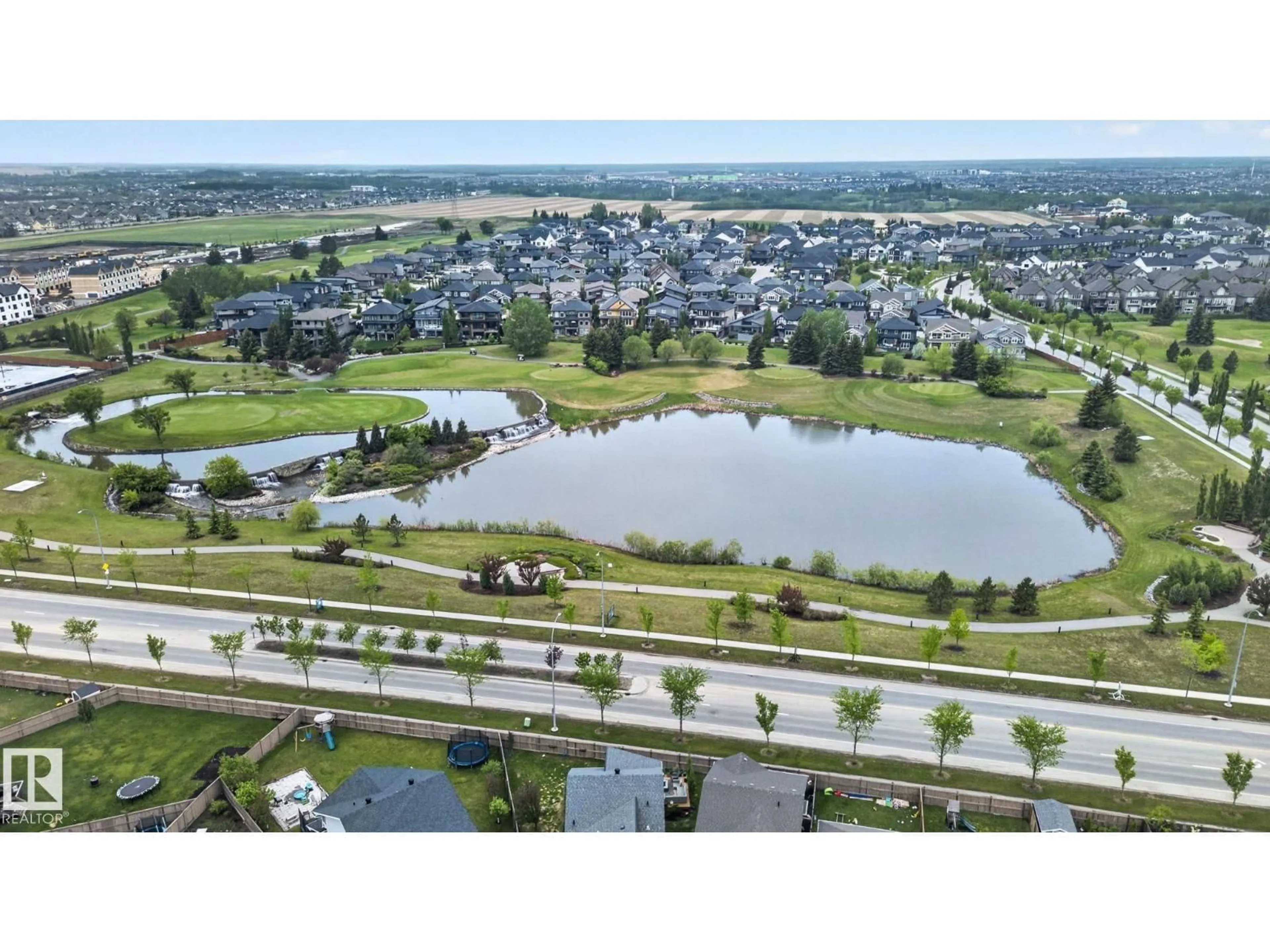 A pic from outside/outdoor area/front of a property/back of a property/a pic from drone, water/lake/river/ocean view for SW - 3806 POWELL WD, Edmonton Alberta T6W2W9