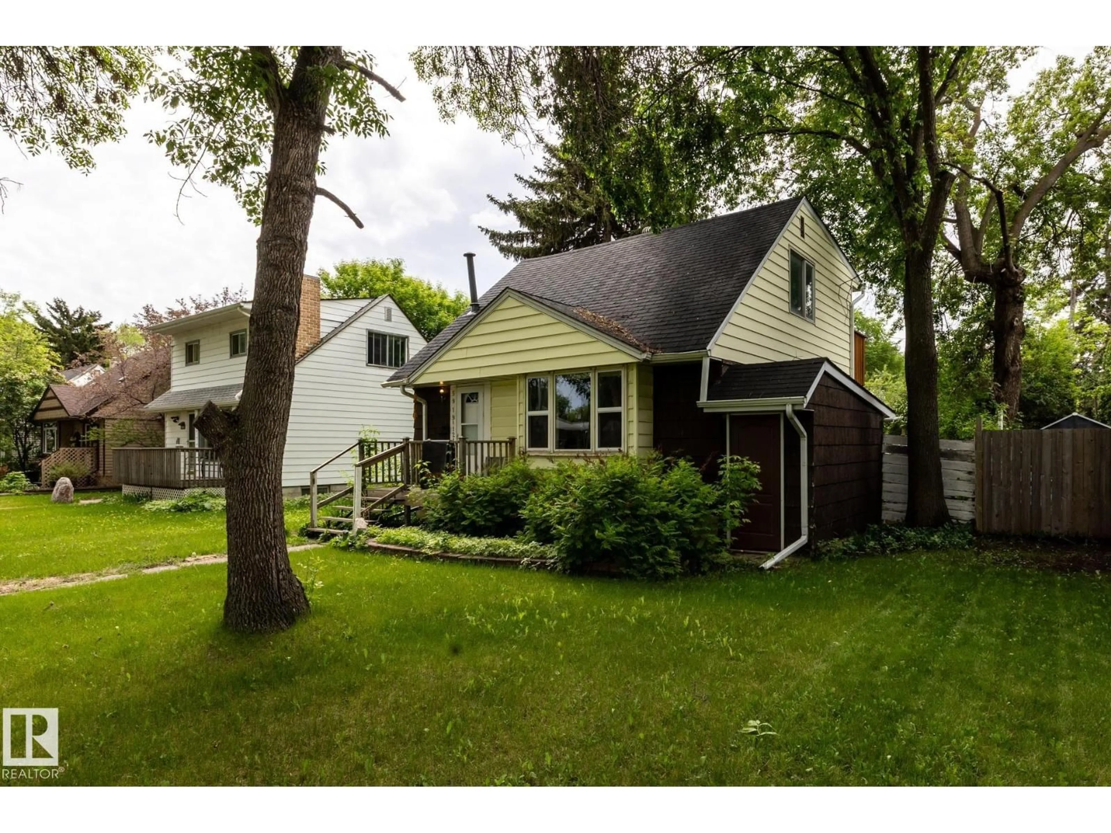 Home with vinyl exterior material, street for 5919 121 AV, Edmonton Alberta T5W1P2