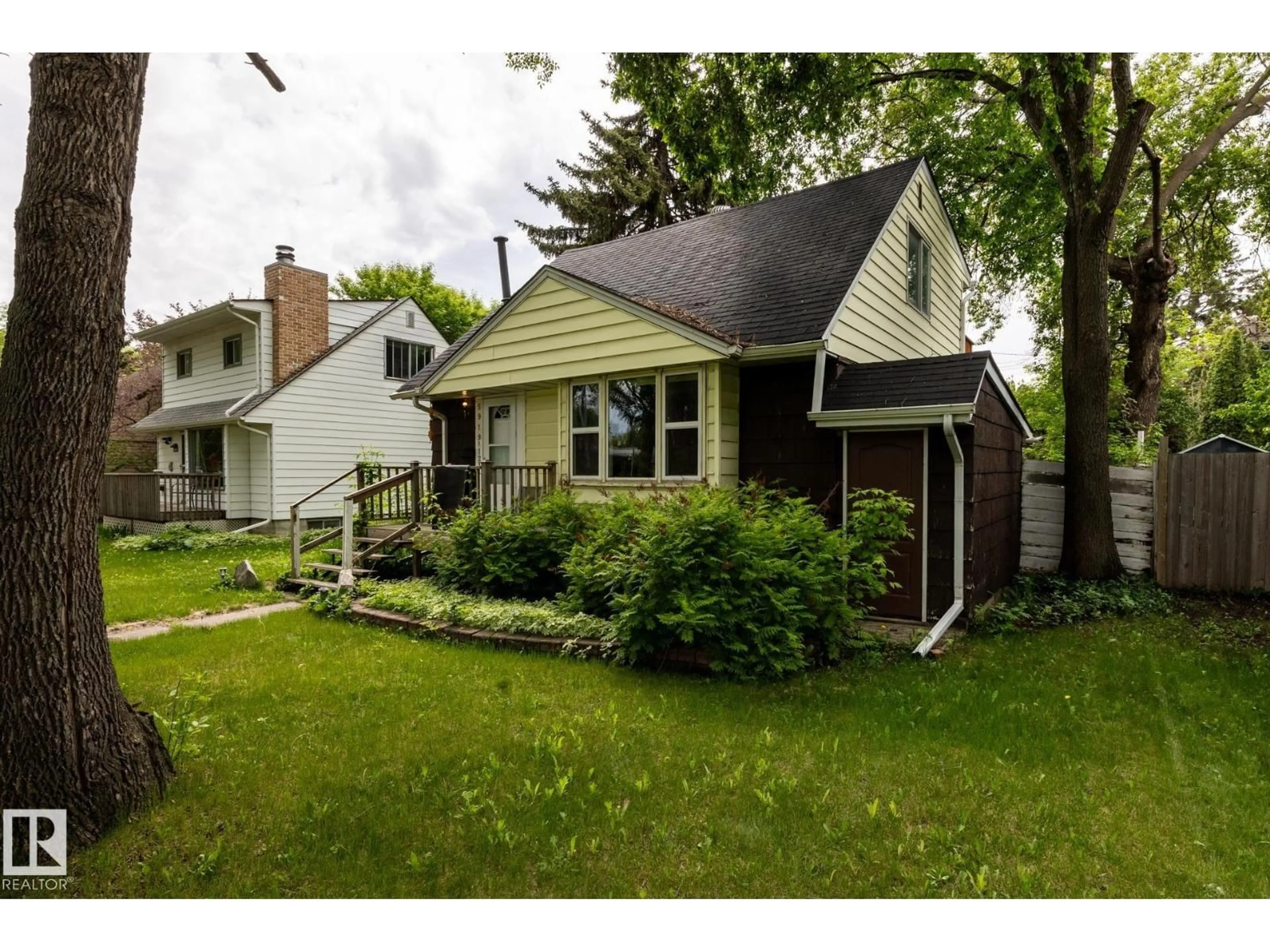 Home with vinyl exterior material, street for 5919 121 AV, Edmonton Alberta T5W1P2