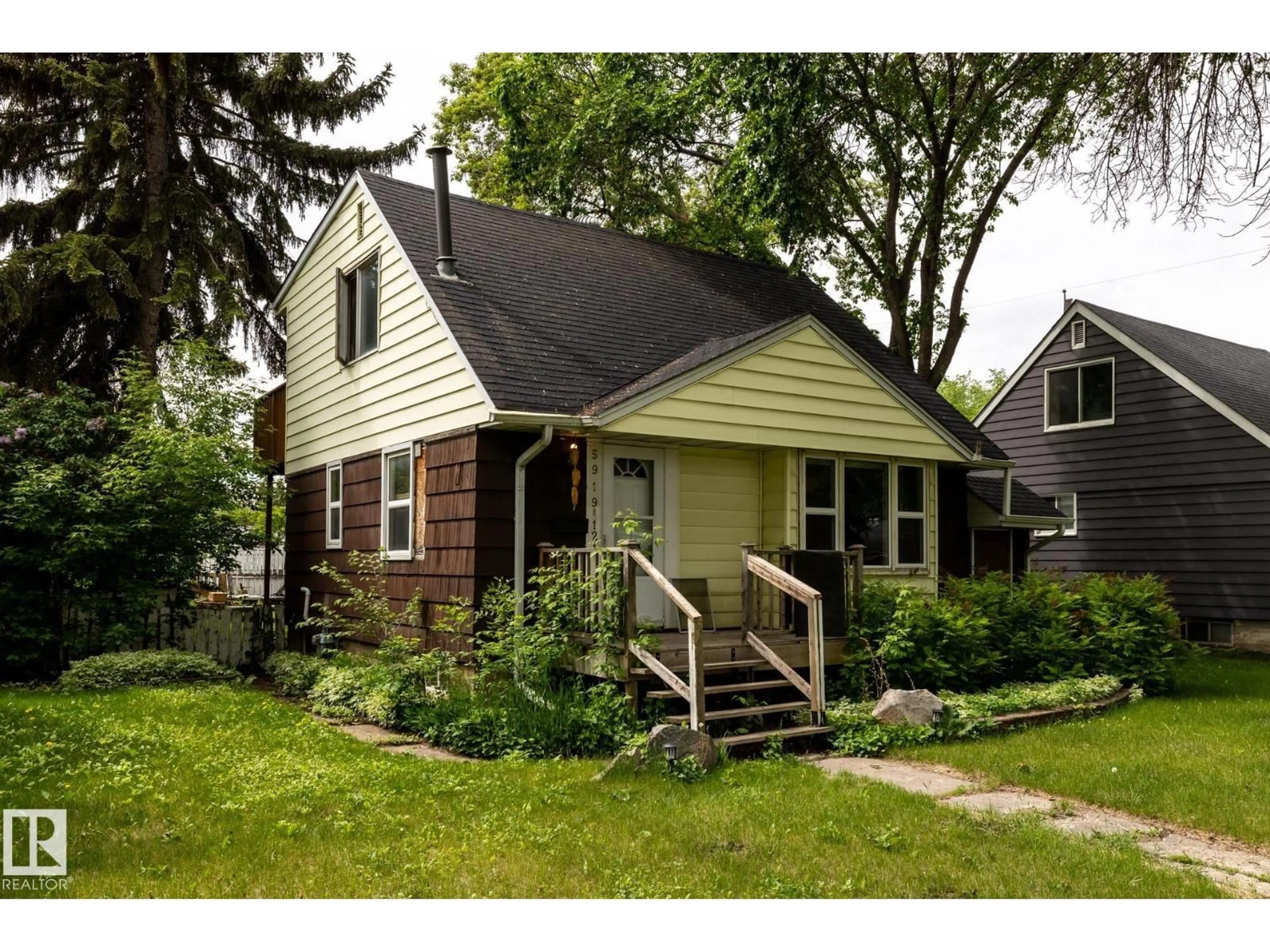 Home with vinyl exterior material, street for 5919 121 AV, Edmonton Alberta T5W1P2