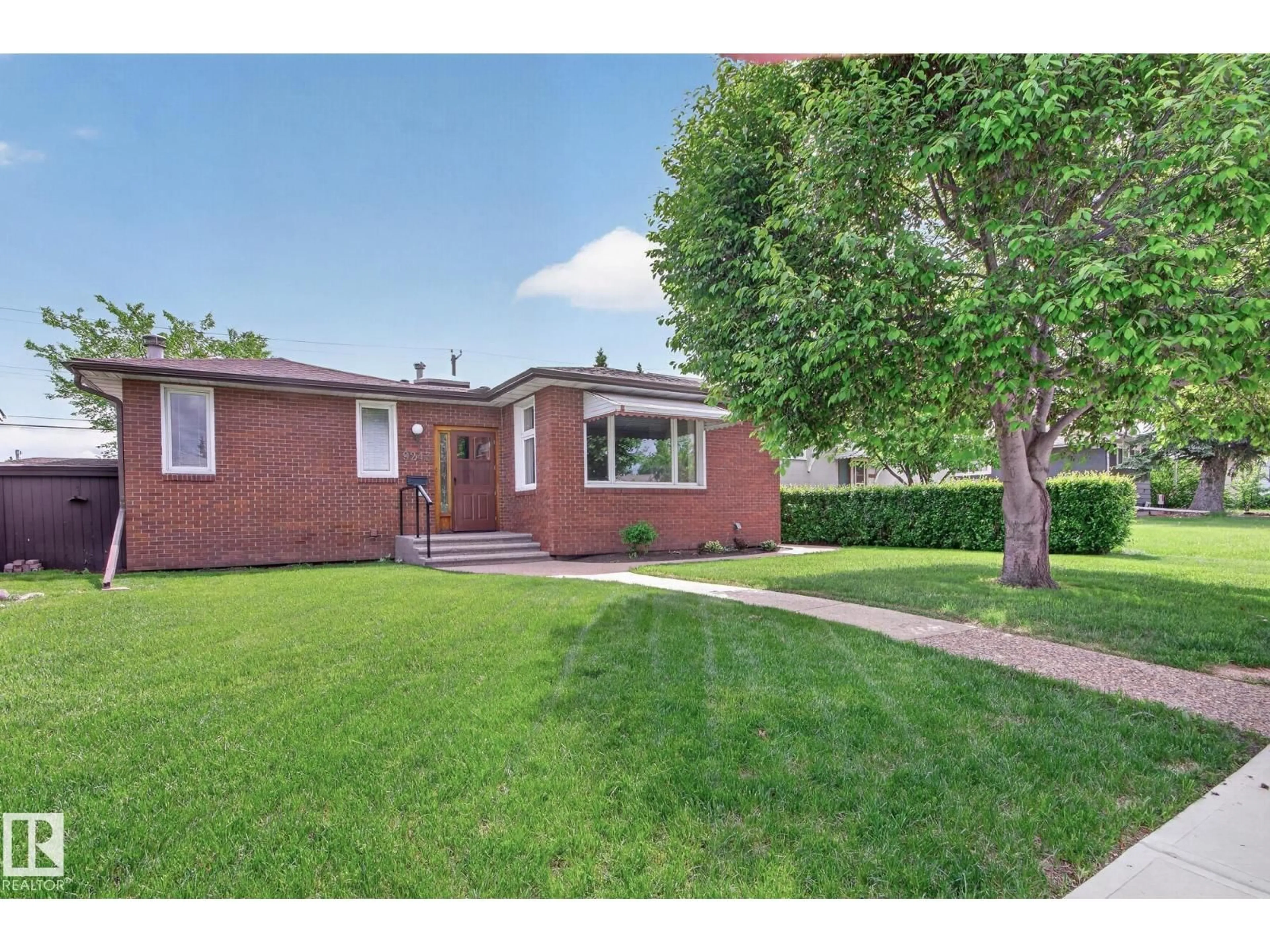 Home with brick exterior material, street for 9243 74 ST, Edmonton Alberta T6B2B5