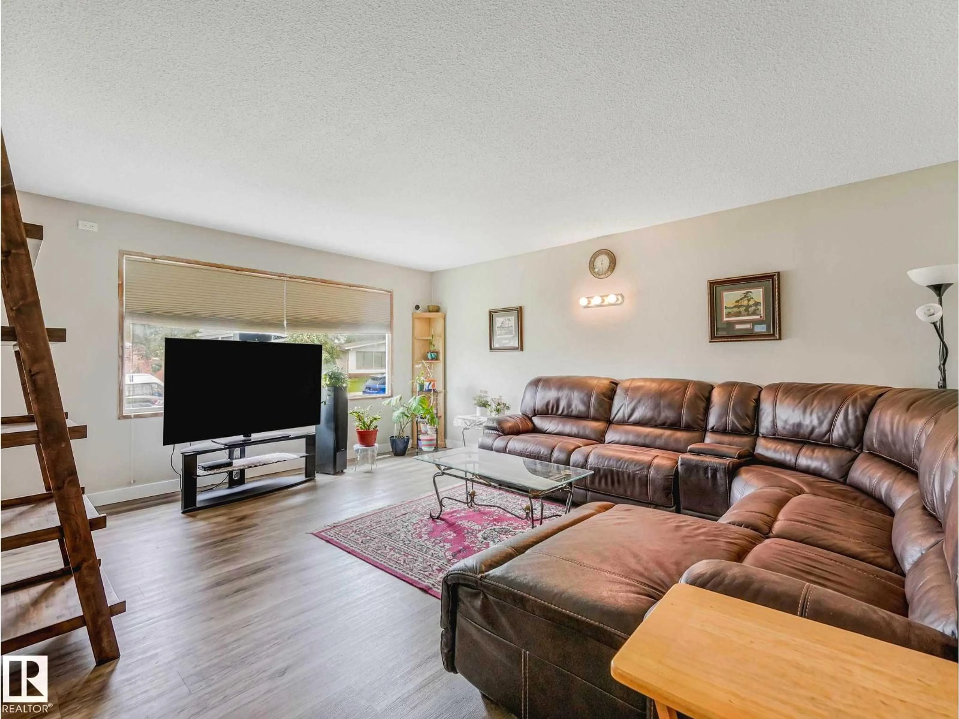 Living room with furniture, wood/laminate floor for NW - 13807 92 ST, Edmonton Alberta T5E3S1