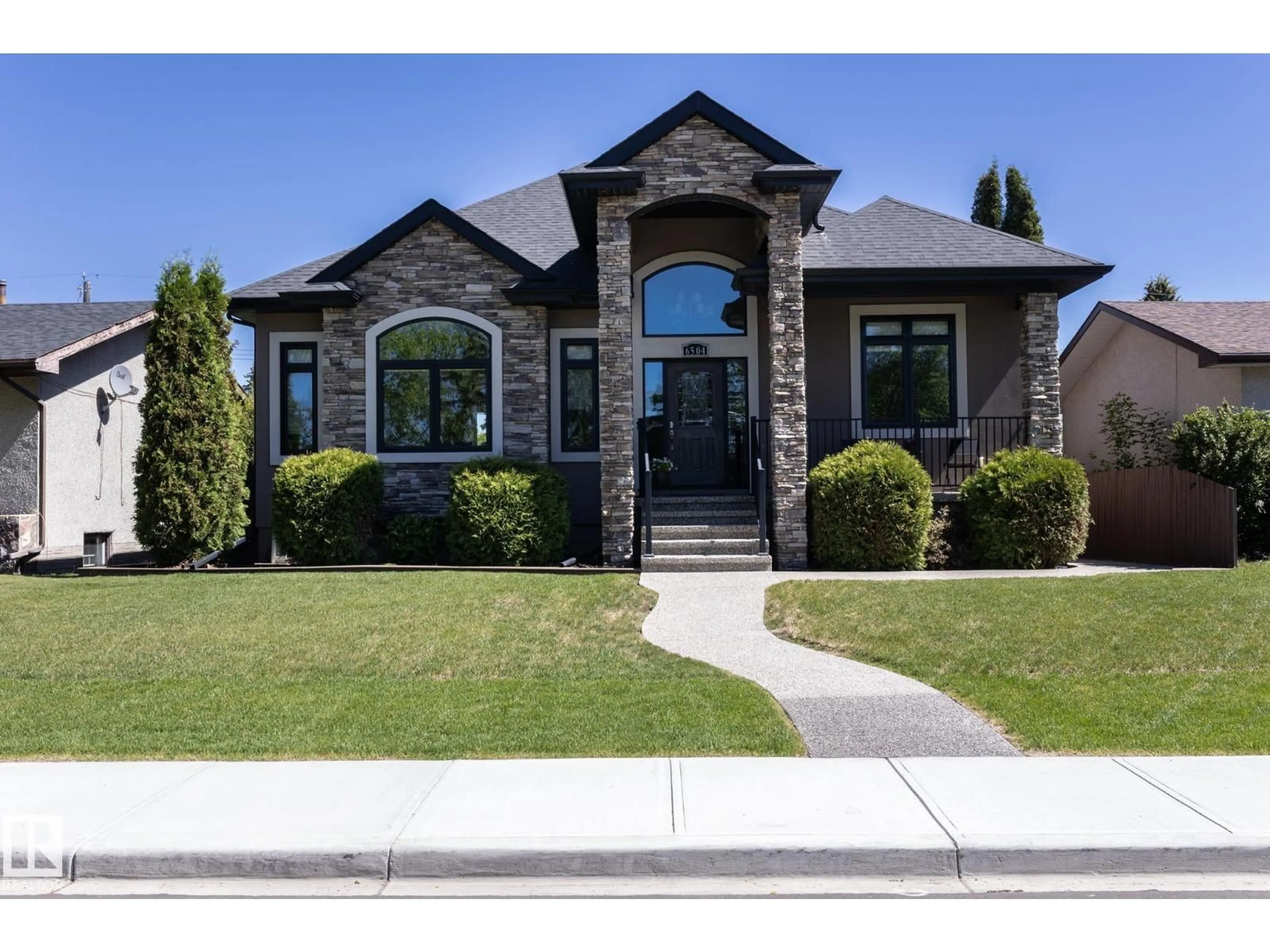 Home with brick exterior material, street for 6504 97 AV, Edmonton Alberta T6B1C5
