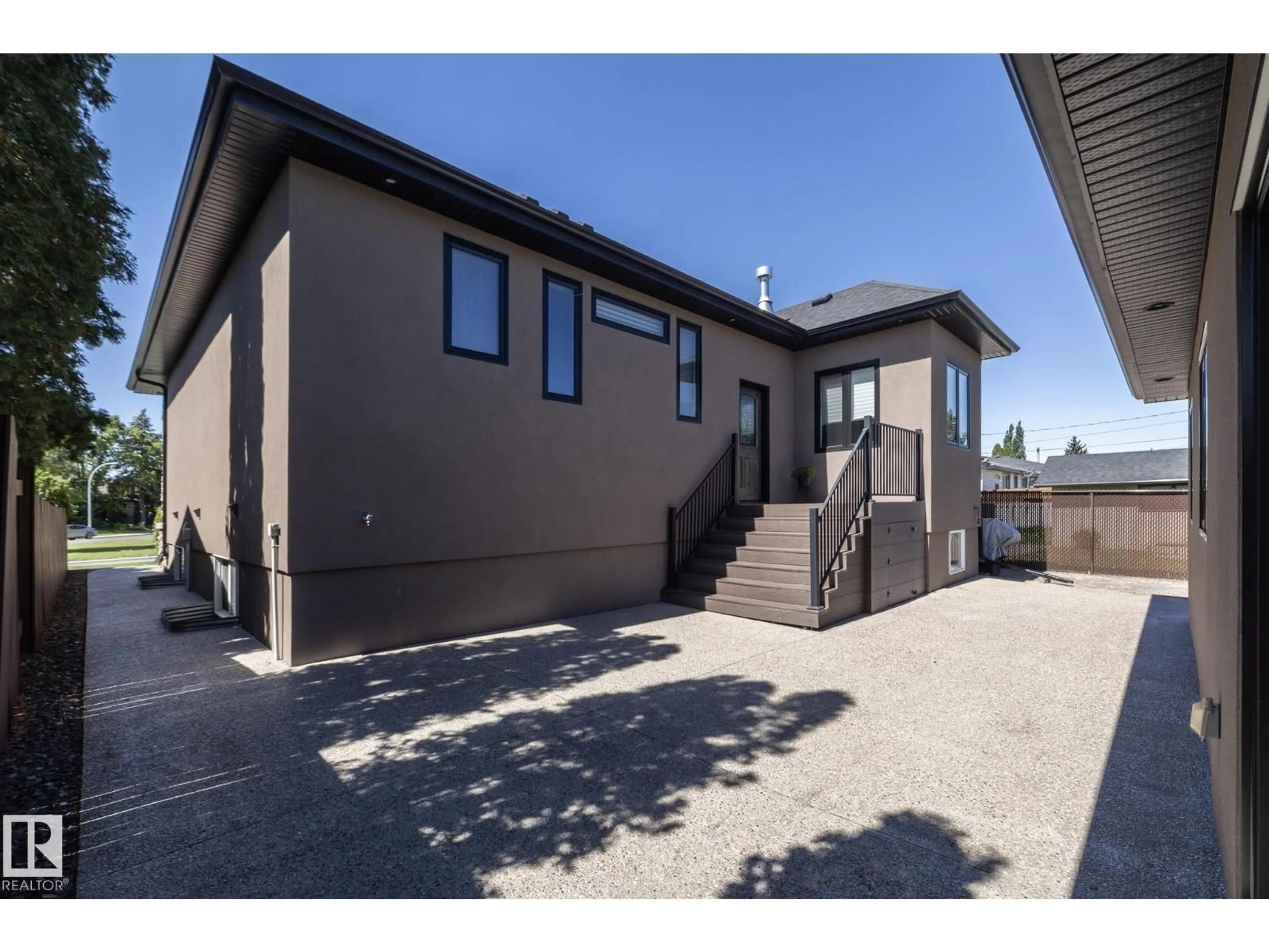 Home with vinyl exterior material, street for 6504 97 AV, Edmonton Alberta T6B1C5