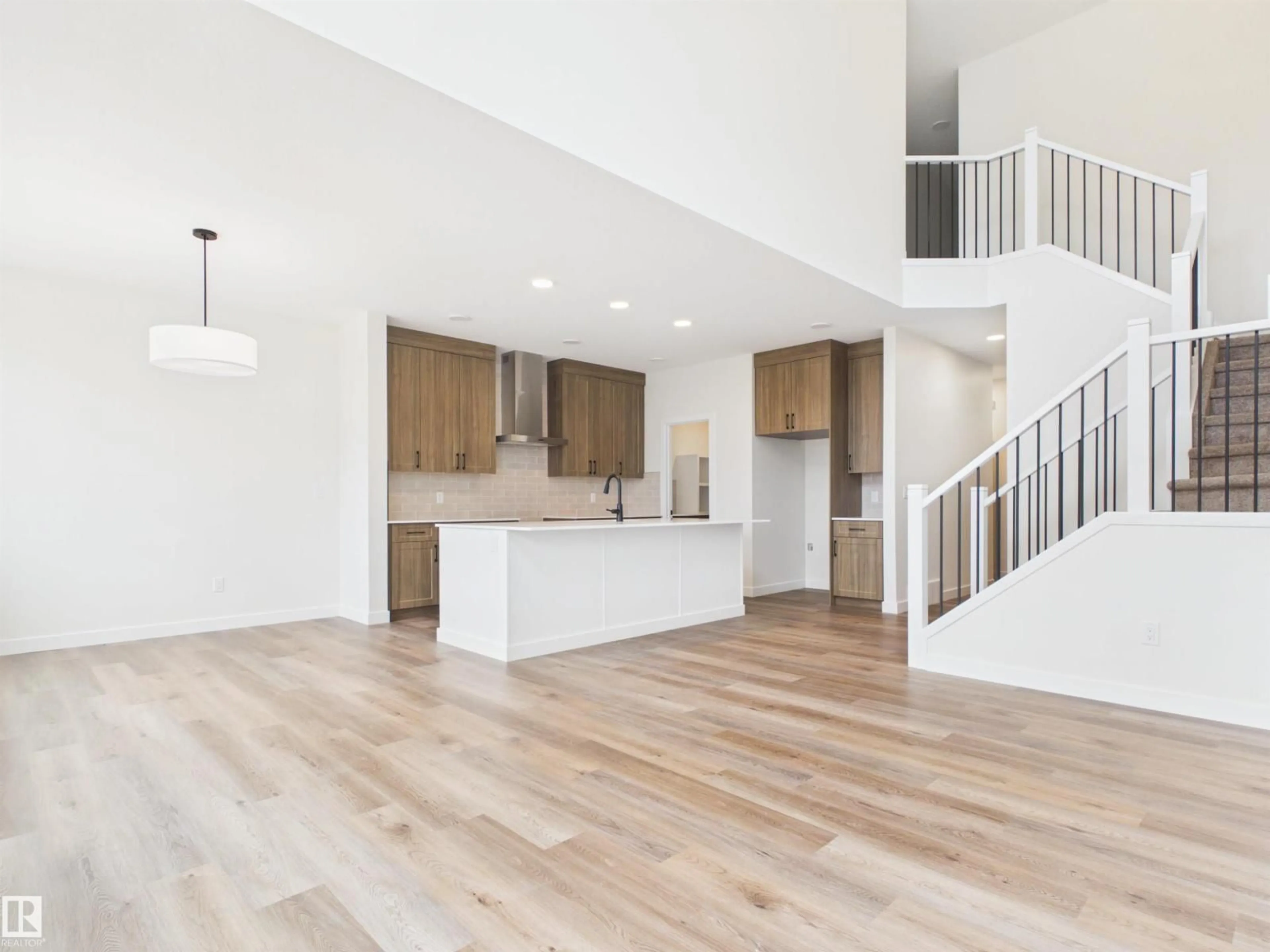Open concept kitchen, wood/laminate floor for 149 FICUS WY, Fort Saskatchewan Alberta T8L1X8
