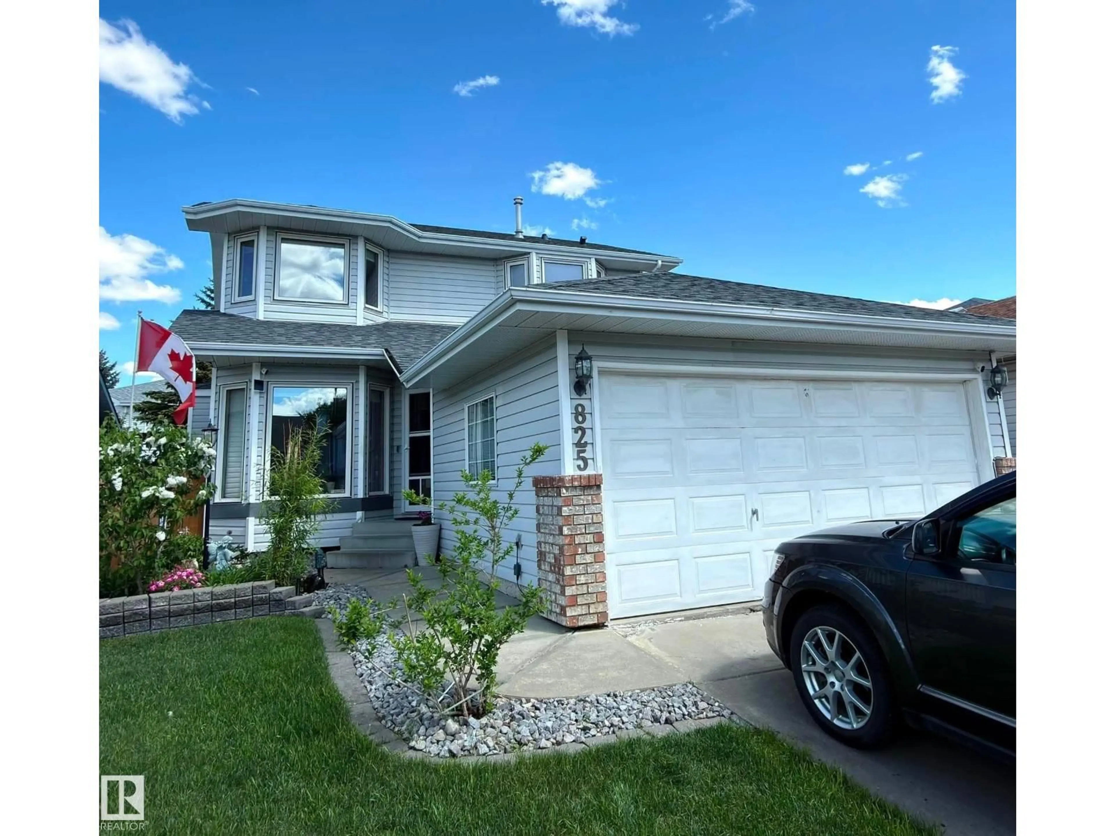 Home with vinyl exterior material, street for NW - 825 112B ST, Edmonton Alberta T6J6W3