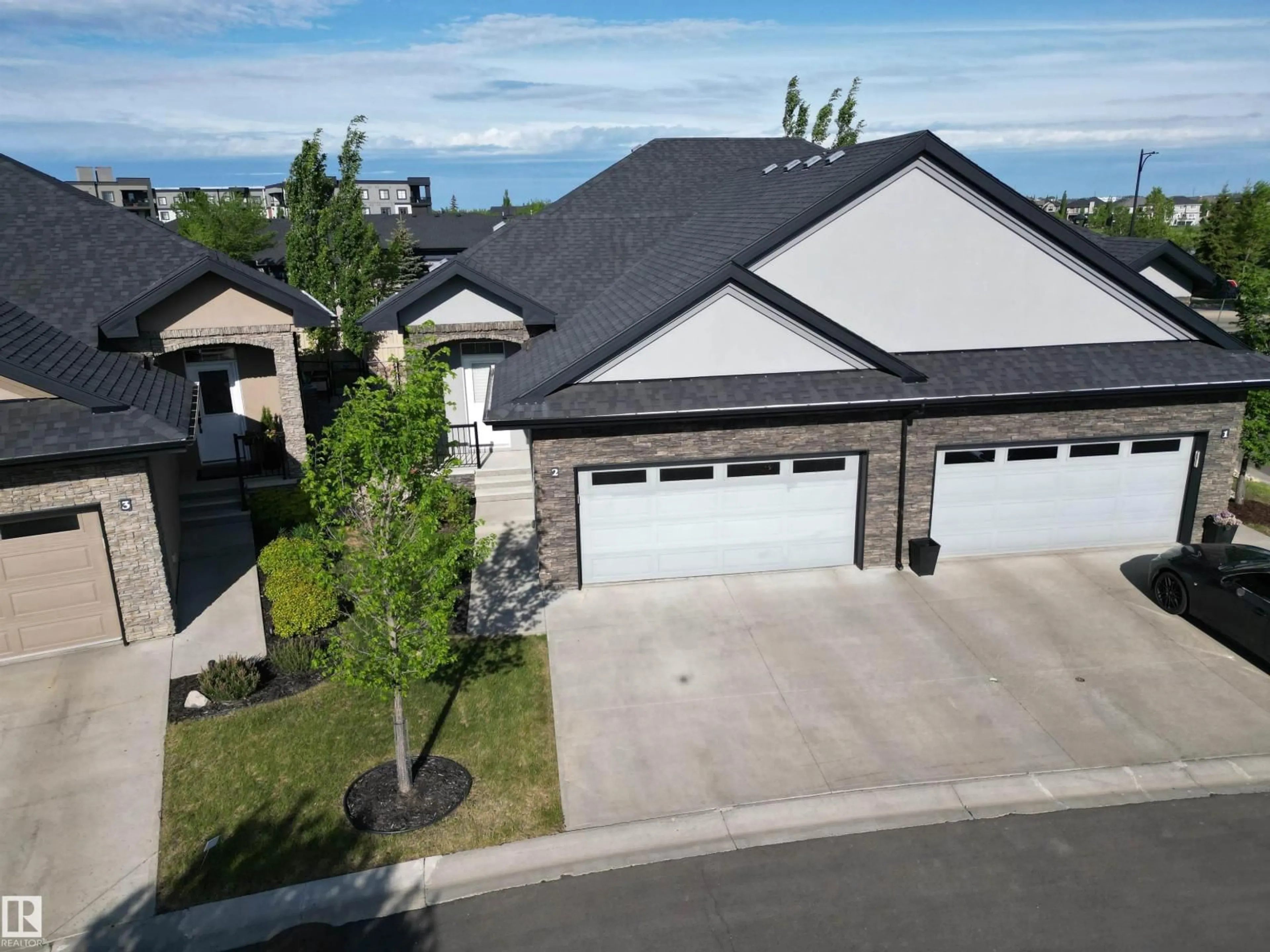A pic from outside/outdoor area/front of a property/back of a property/a pic from drone, street for #2 - 104 ALLARD LI, Edmonton Alberta T6W2N2
