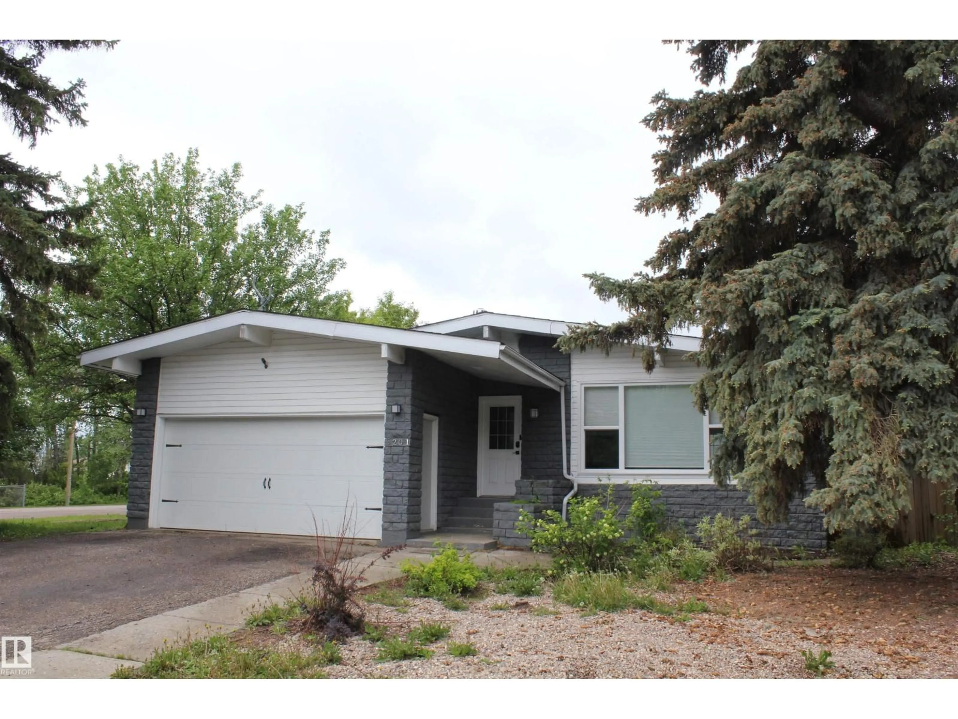Home with vinyl exterior material, street for 5201 RAVINE DR, Elk Point Alberta T0A1A0