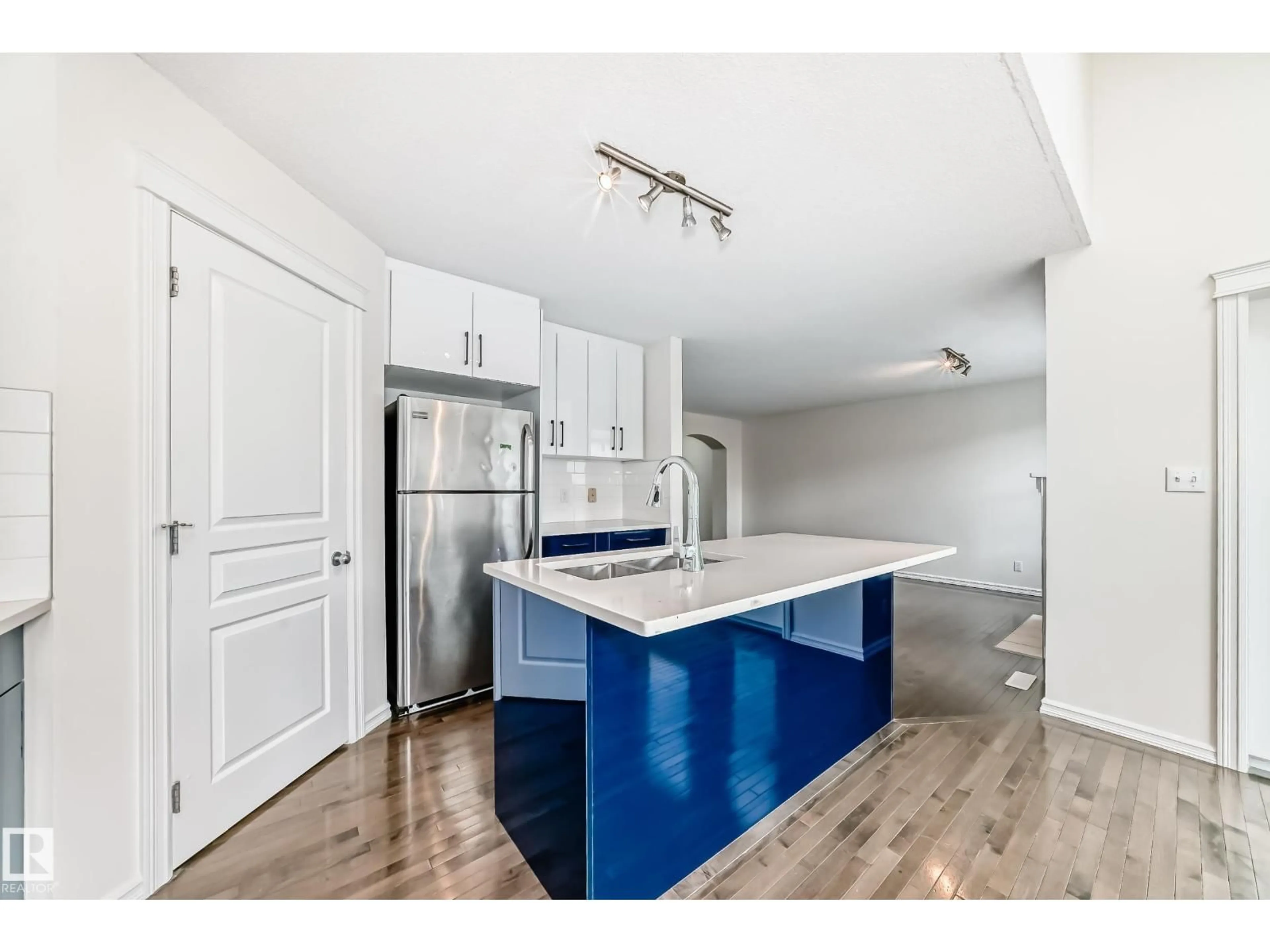 Open concept kitchen, wood/laminate floor for 21208 89A AVENUE, Edmonton Alberta T5T6V5