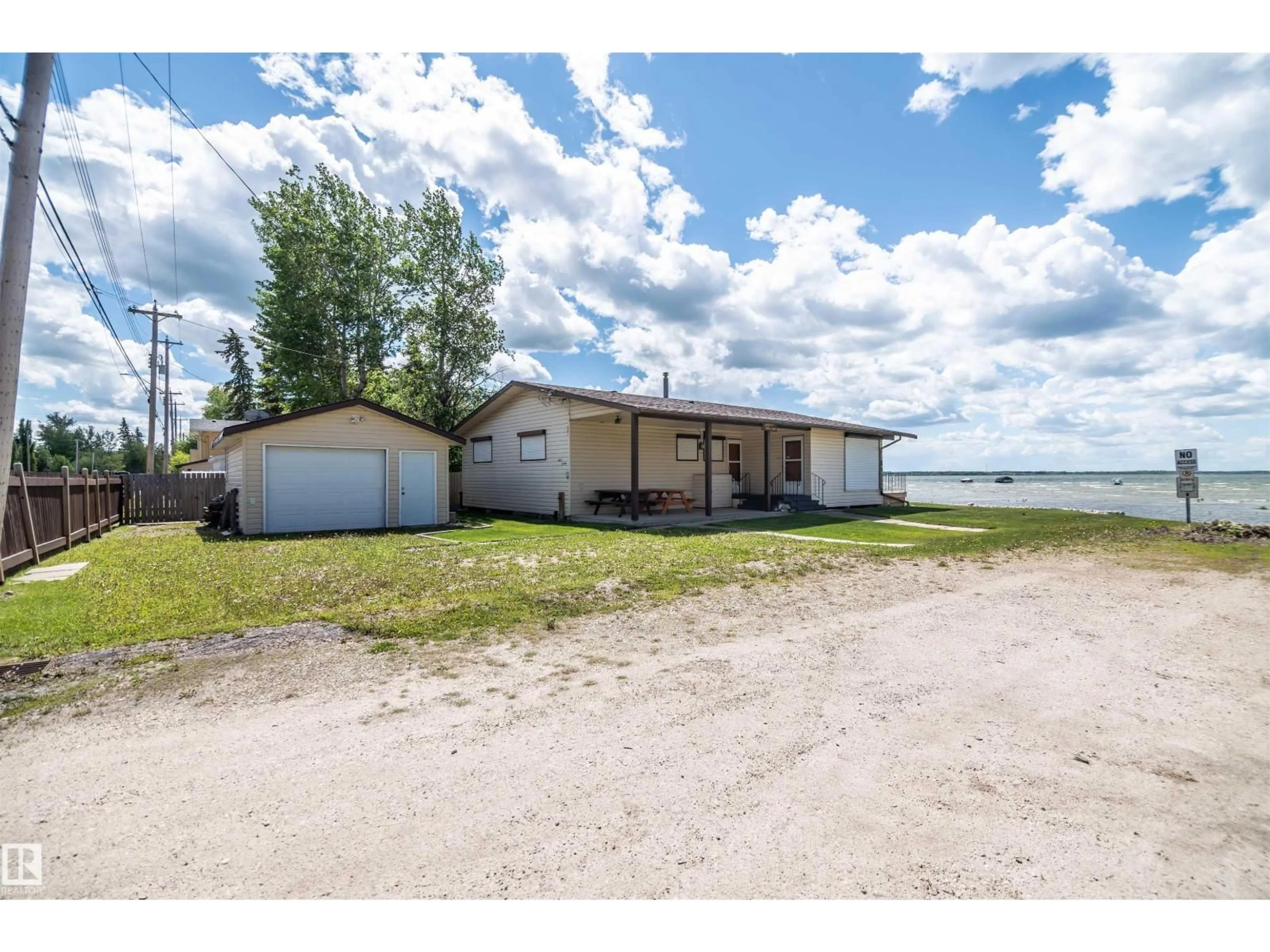 A pic from outside/outdoor area/front of a property/back of a property/a pic from drone, water/lake/river/ocean view for 4404 50 AV, Rural Lac Ste. Anne County Alberta T0E0A0