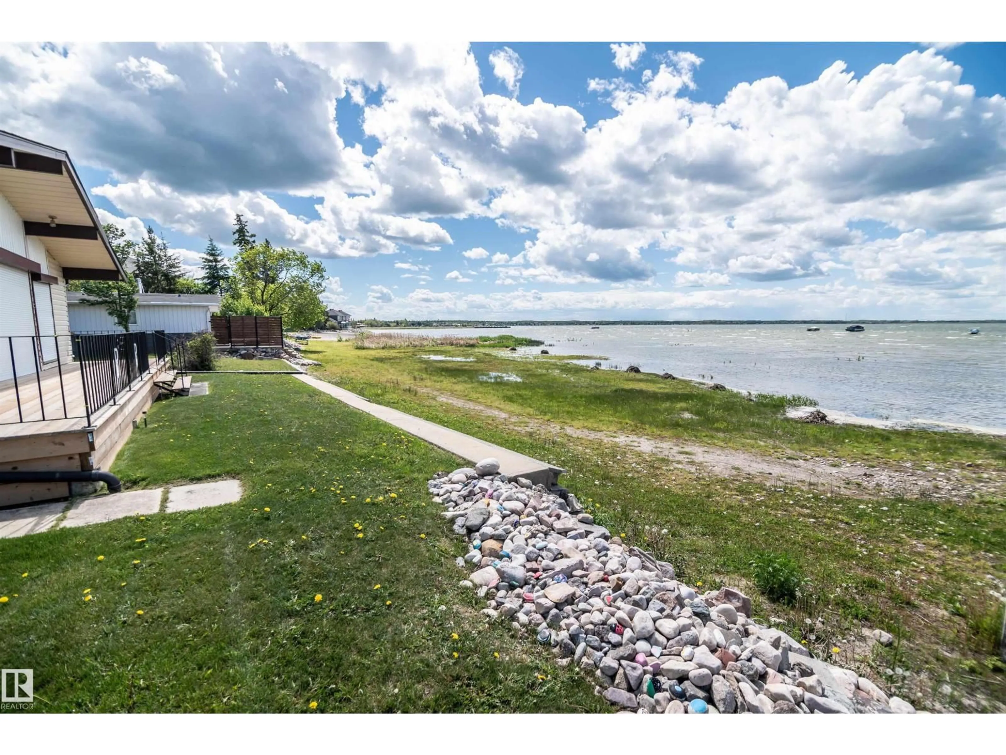 A pic from outside/outdoor area/front of a property/back of a property/a pic from drone, water/lake/river/ocean view for 4404 50 AV, Rural Lac Ste. Anne County Alberta T0E0A0