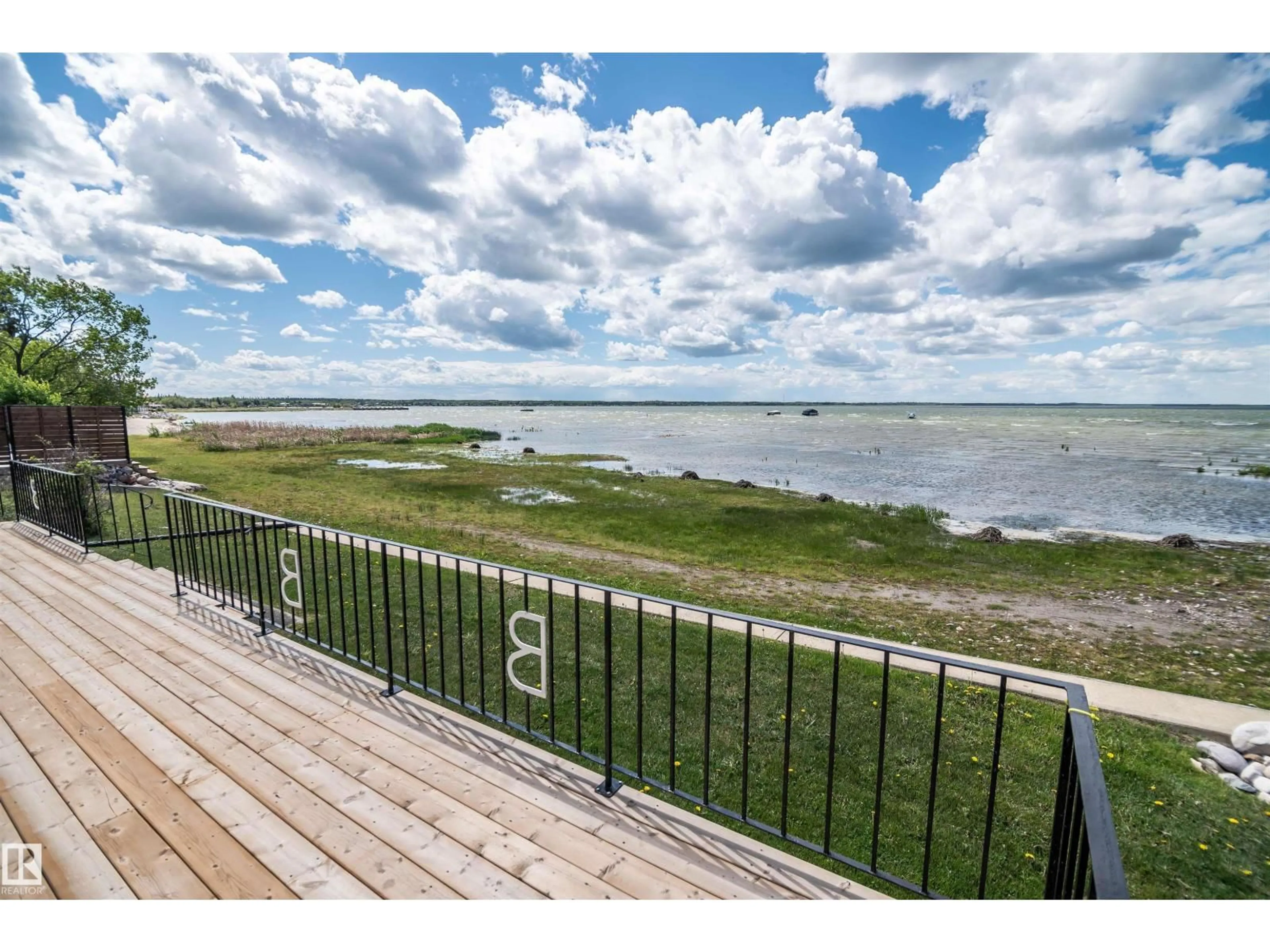 A pic from outside/outdoor area/front of a property/back of a property/a pic from drone, water/lake/river/ocean view for 4404 50 AV, Rural Lac Ste. Anne County Alberta T0E0A0