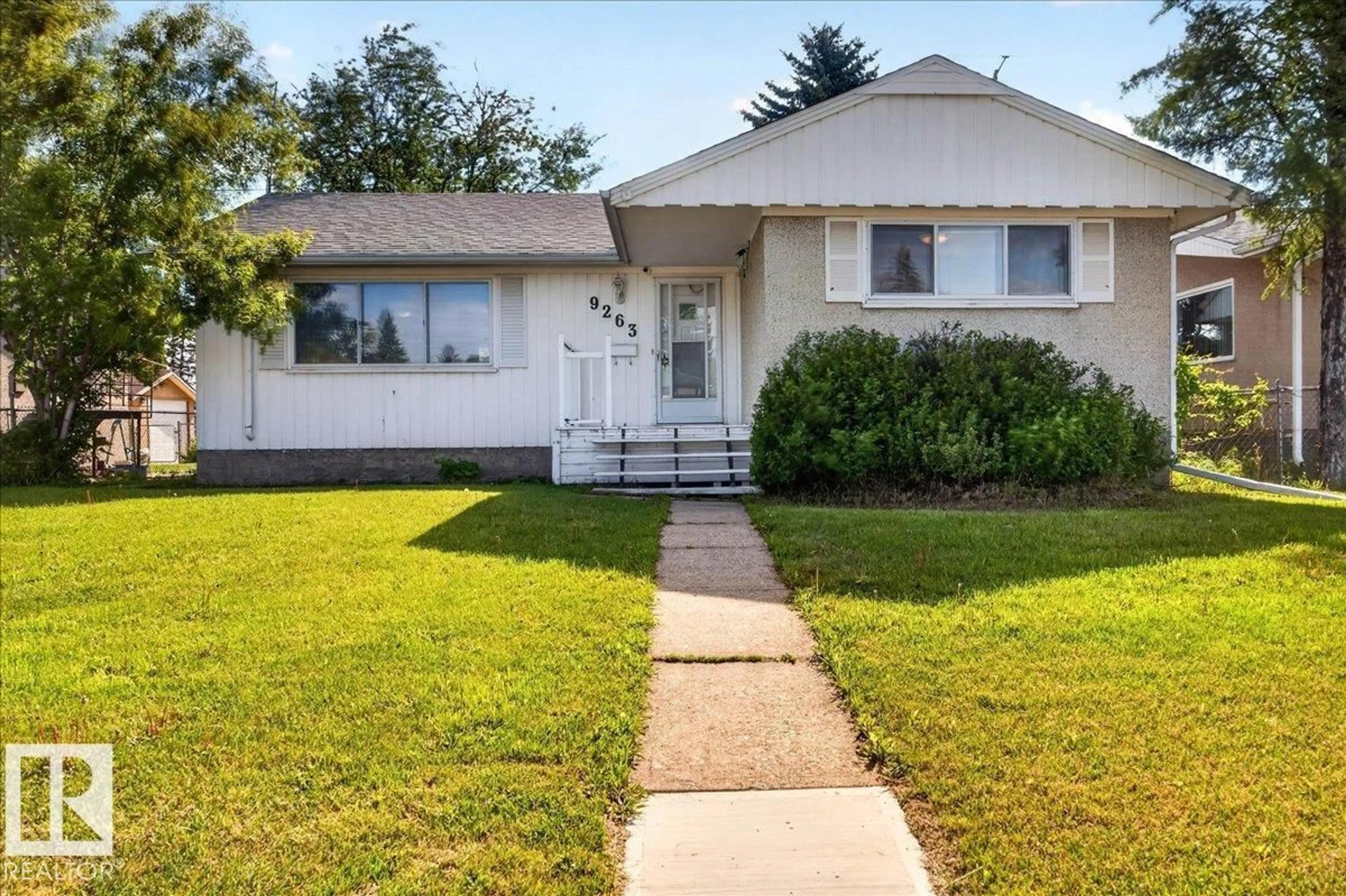 Home with vinyl exterior material, street for 9263 74 ST, Edmonton Alberta T6B2B5