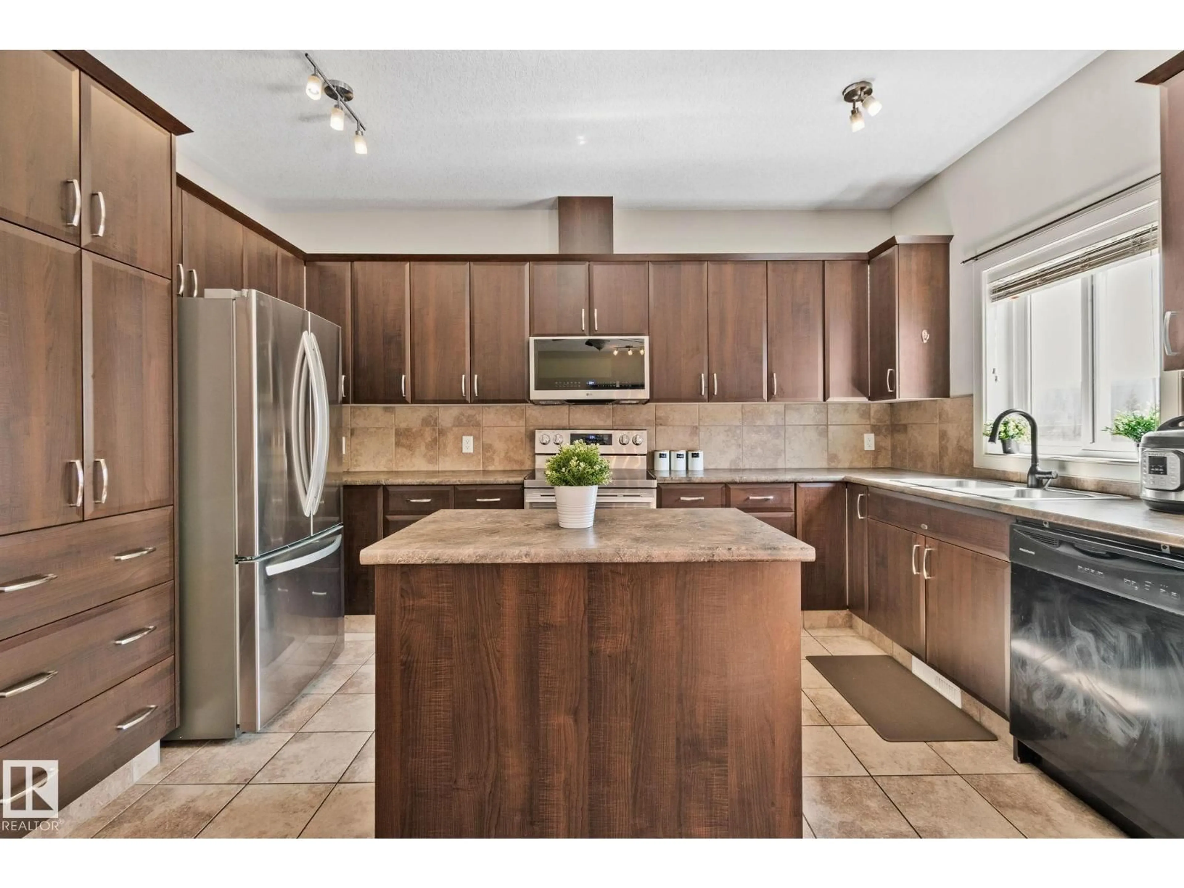 Open concept kitchen, unknown for #2 - 450 MCCONACHIE WY, Edmonton Alberta T5Y0S8