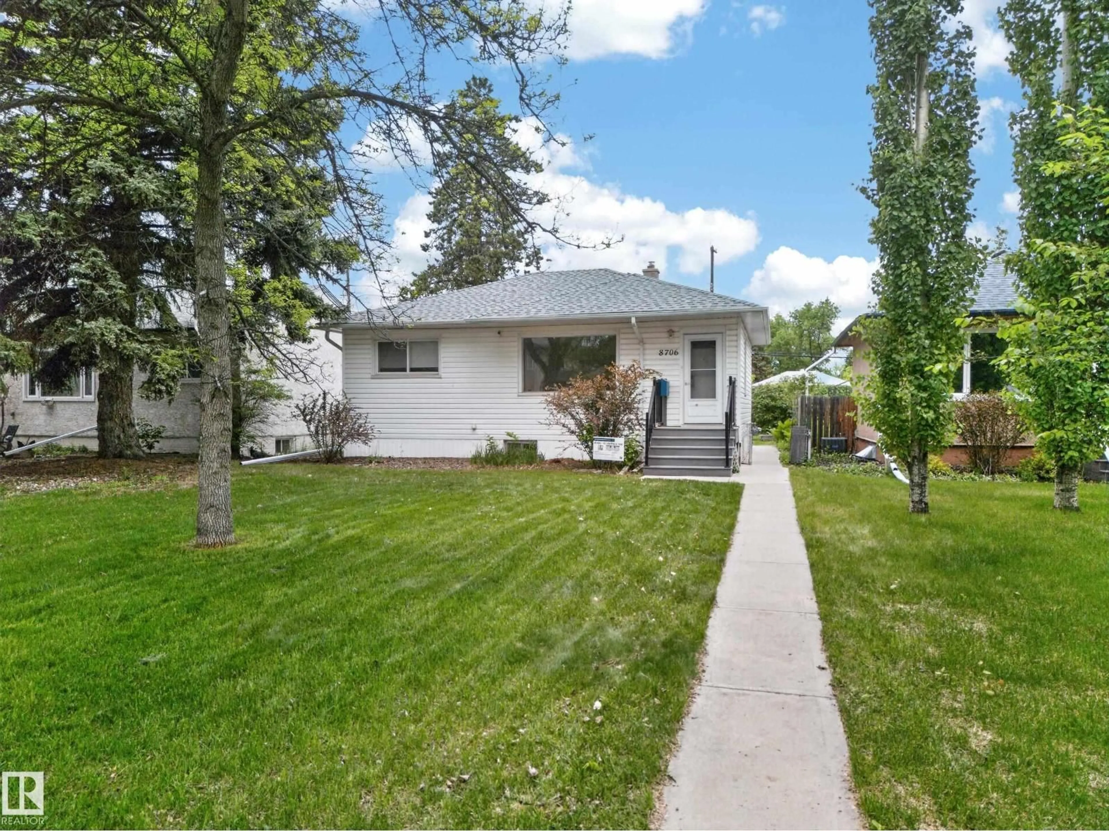 Home with vinyl exterior material, street for 8706 83 AV, Edmonton Alberta T6C1B3