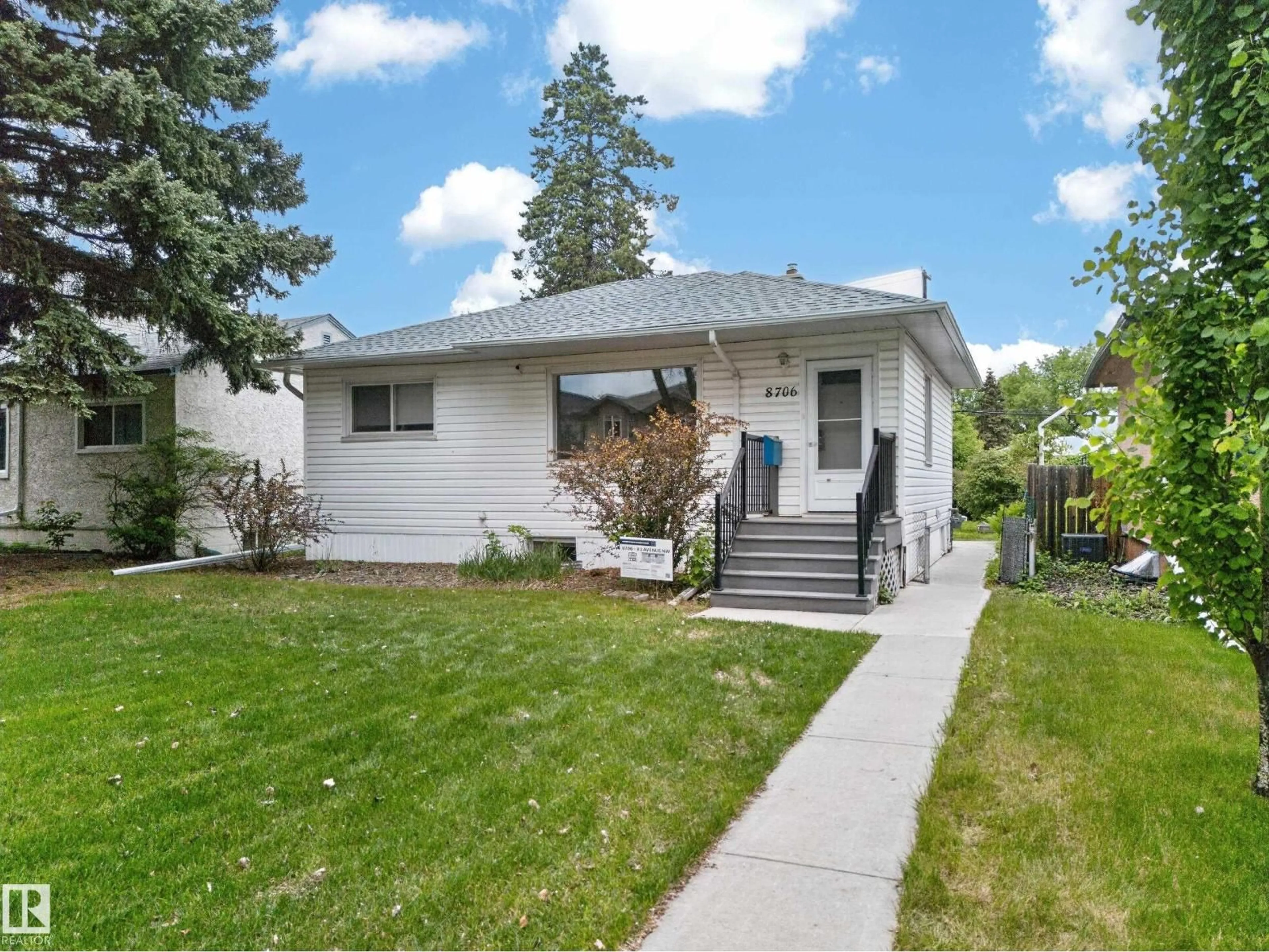 Home with vinyl exterior material, street for 8706 83 AV, Edmonton Alberta T6C1B3