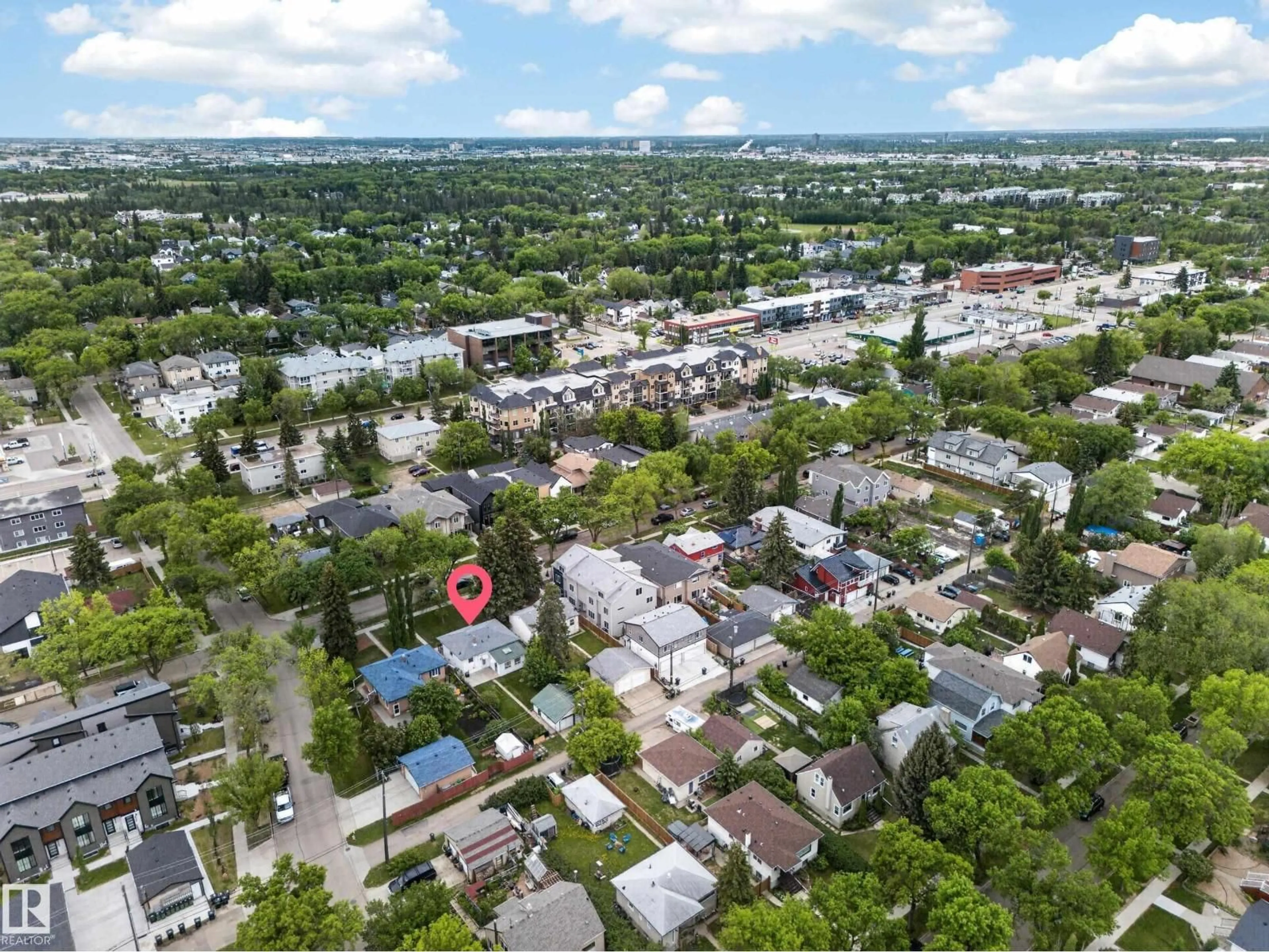 A pic from outside/outdoor area/front of a property/back of a property/a pic from drone, street for 8706 83 AV, Edmonton Alberta T6C1B3
