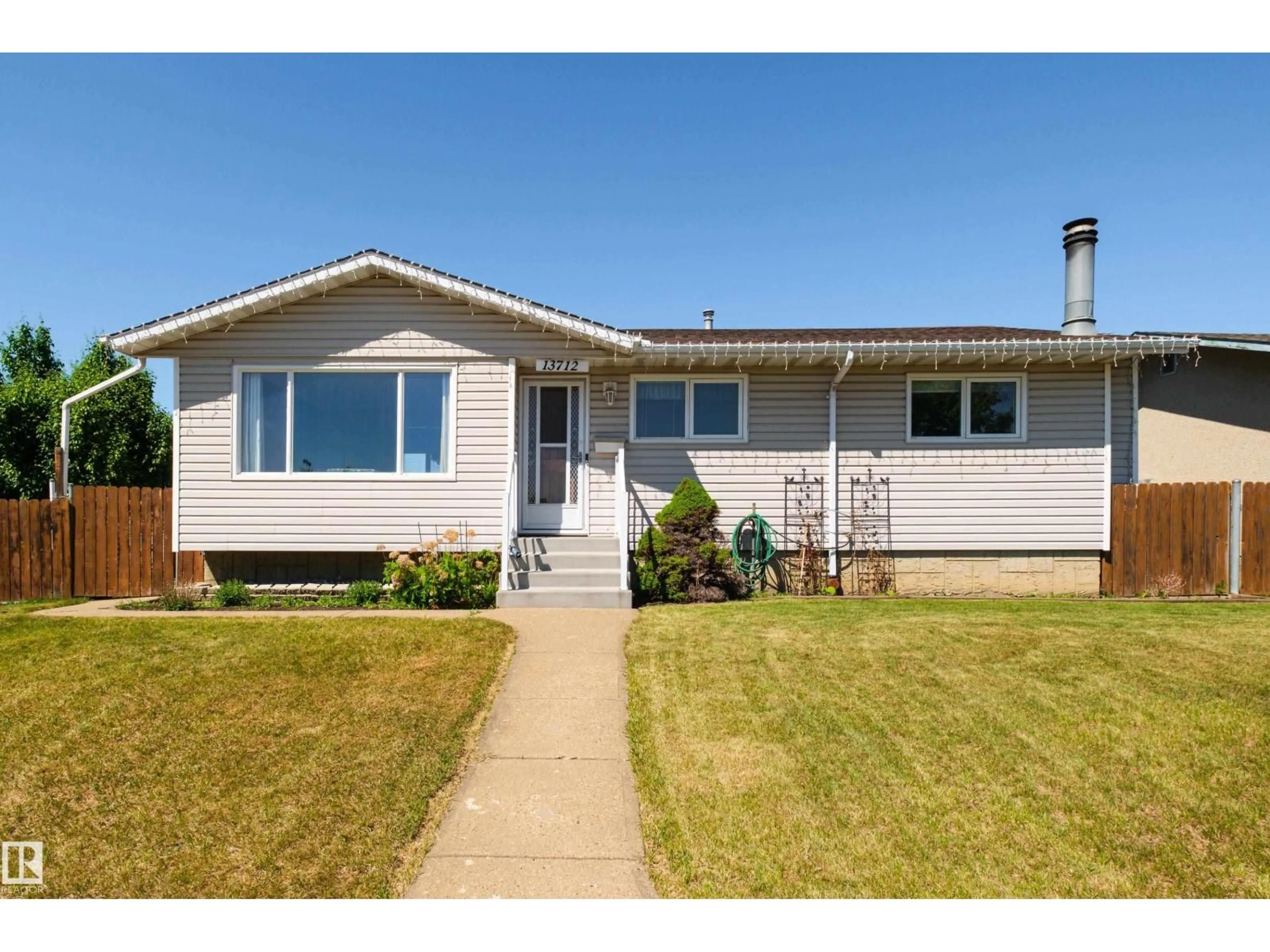 Home with vinyl exterior material, street for NW - 13712 87 ST, Edmonton Alberta T5E3E9