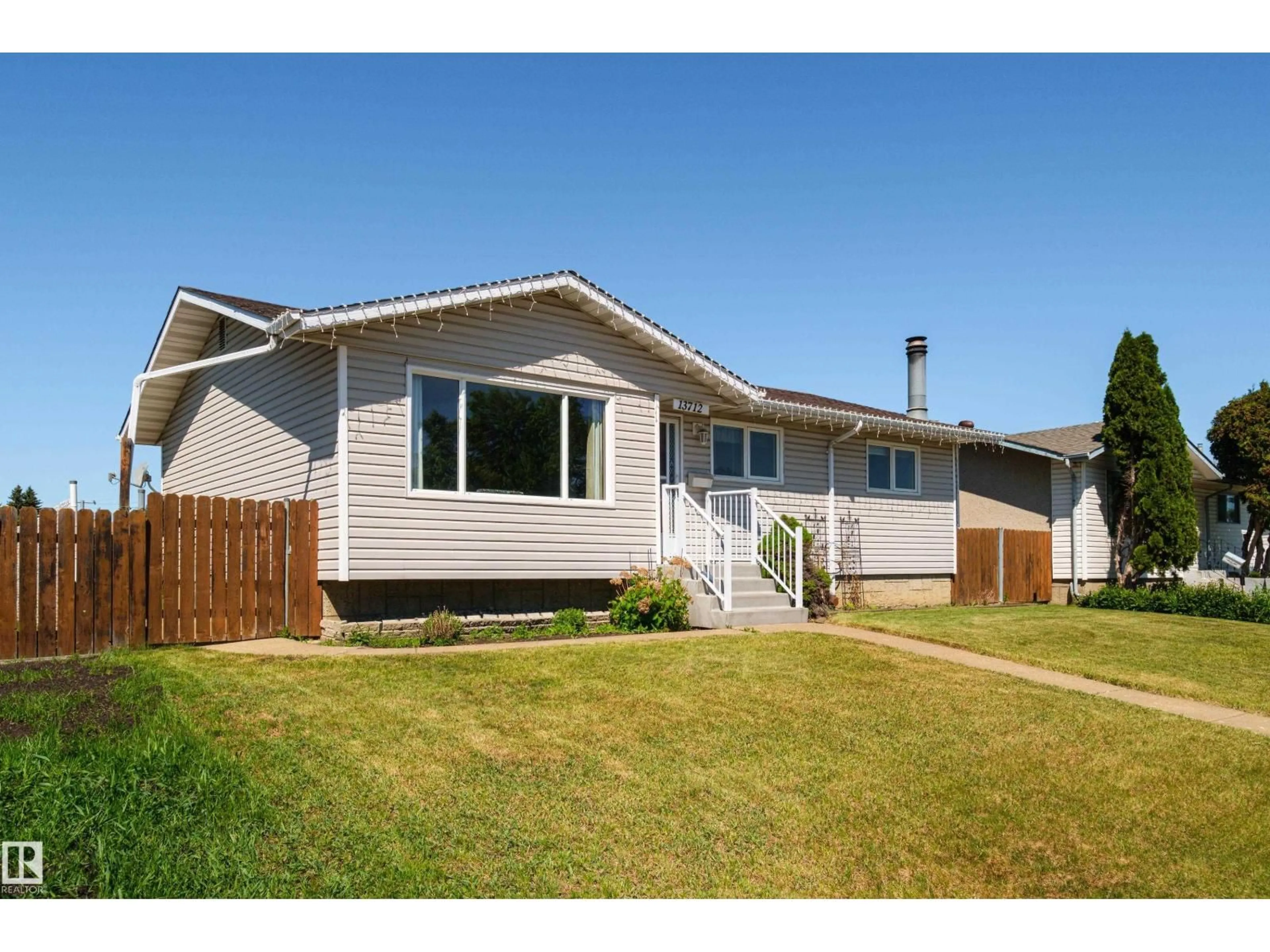 Home with vinyl exterior material, street for NW - 13712 87 ST, Edmonton Alberta T5E3E9