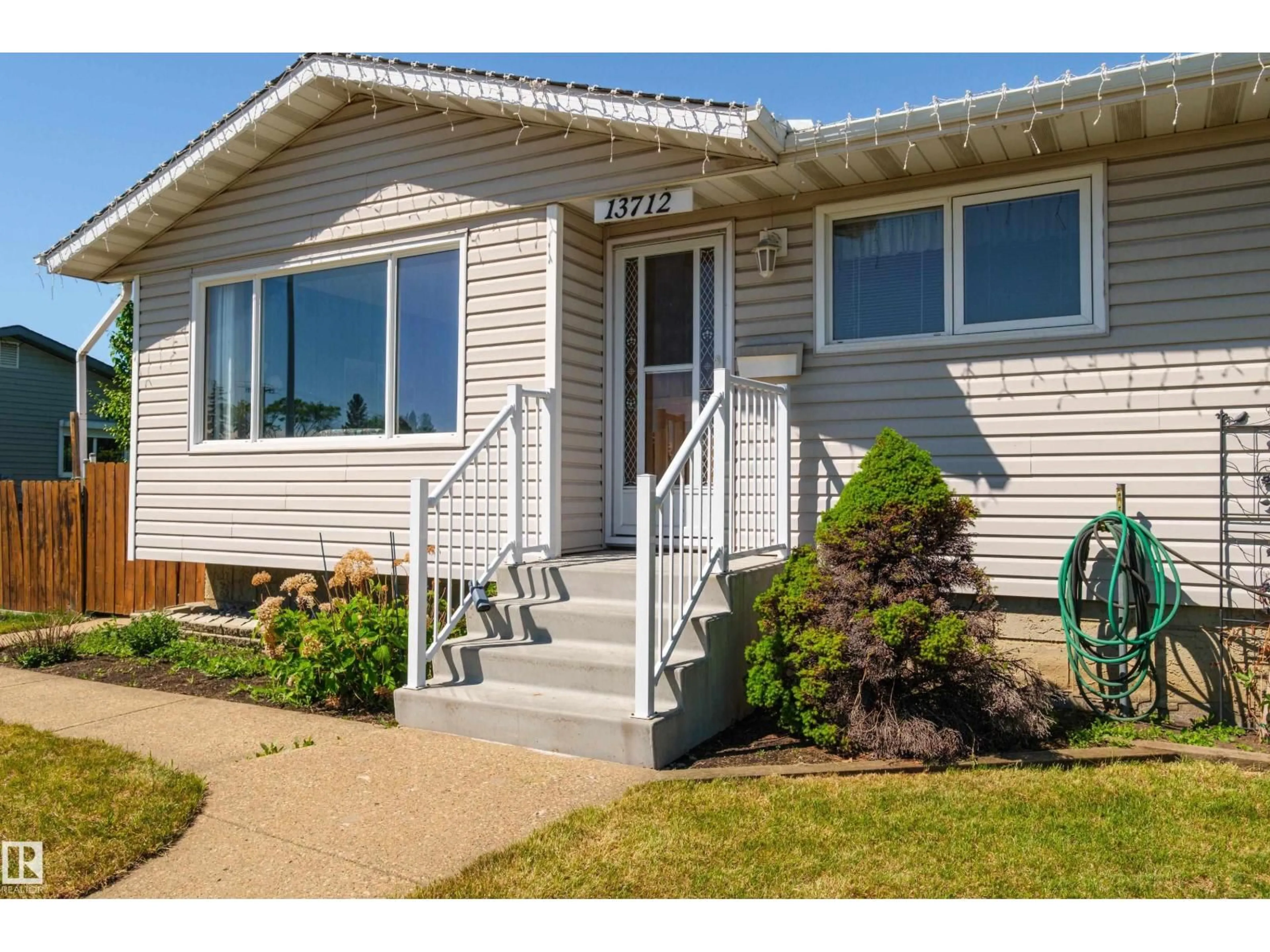 Home with vinyl exterior material, street for NW - 13712 87 ST, Edmonton Alberta T5E3E9
