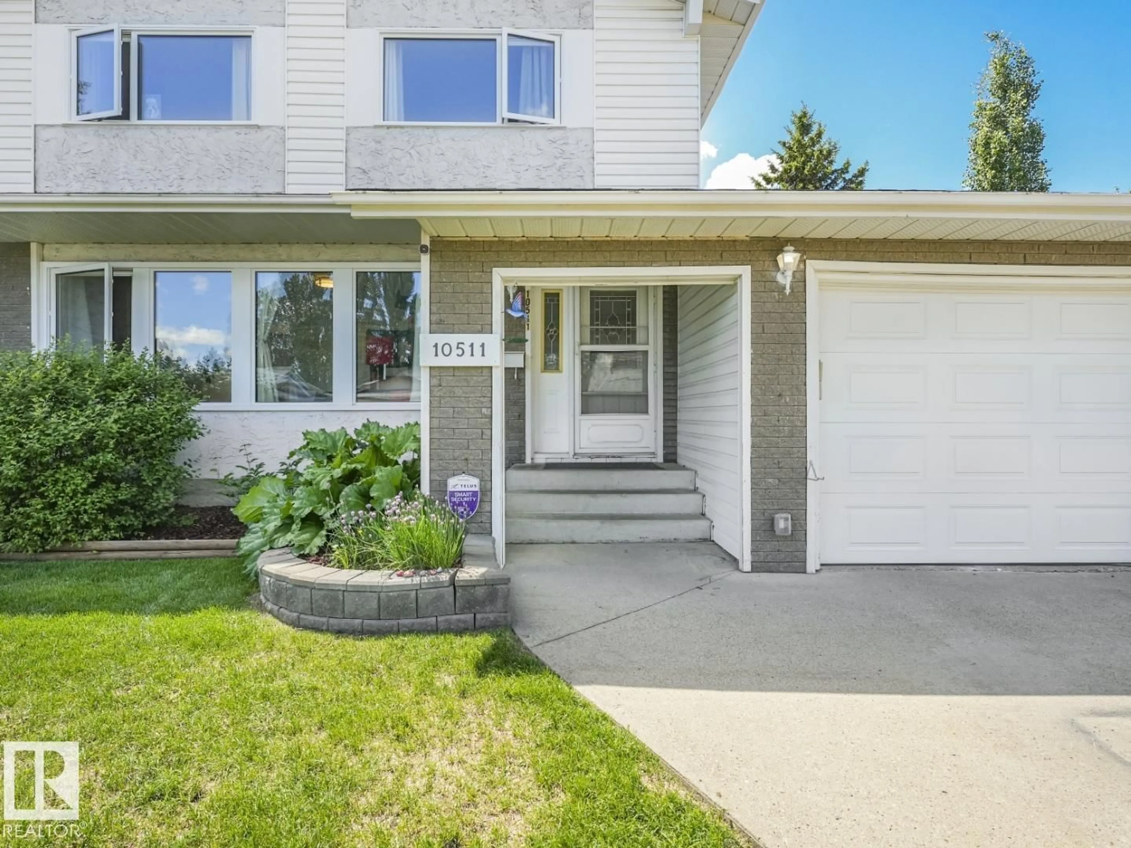 Home with vinyl exterior material, street for 10511 26 AV, Edmonton Alberta T6J4C1