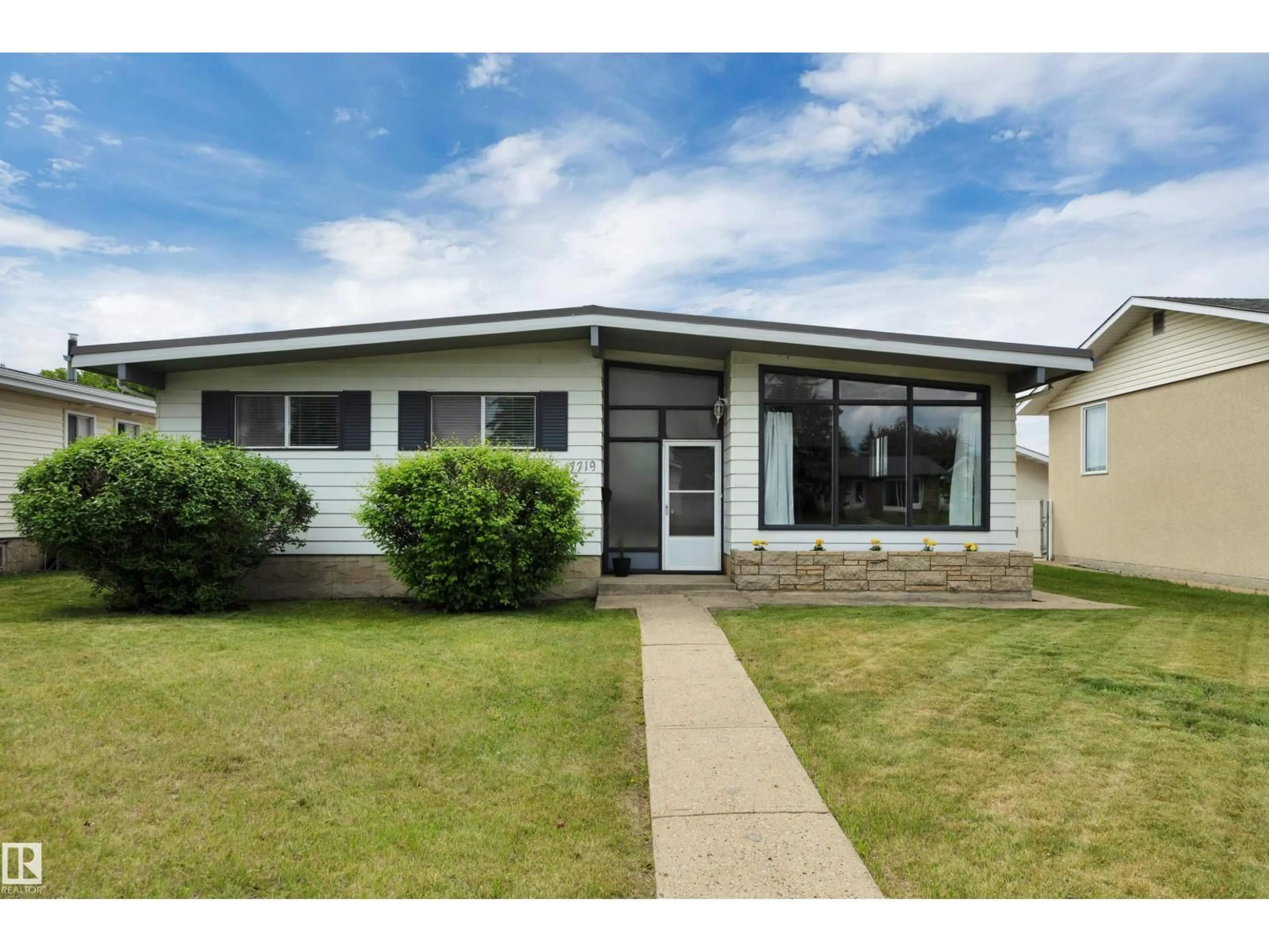 Home with vinyl exterior material, street for 7719 144 AV, Edmonton Alberta T5C2R9