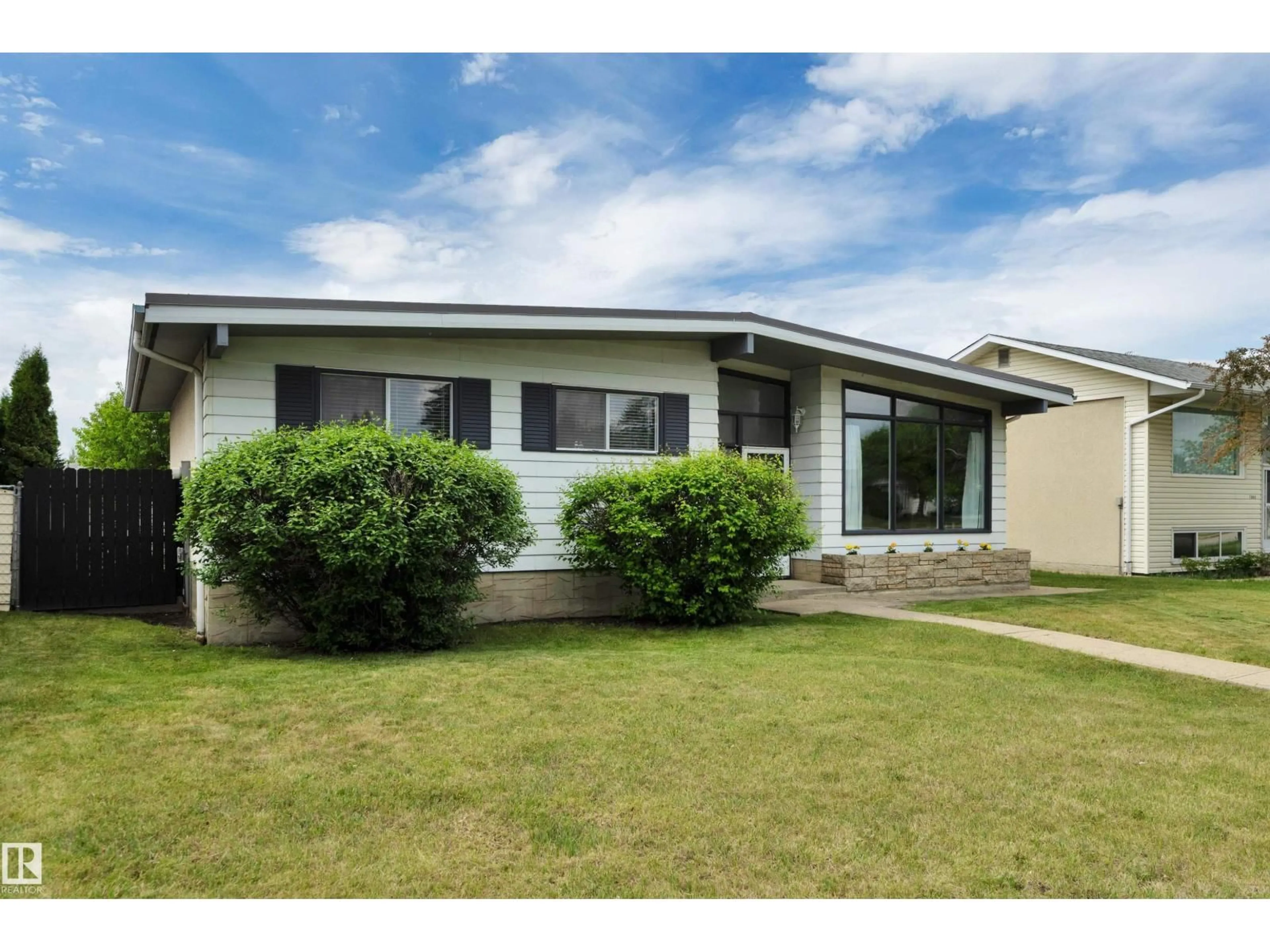 Home with vinyl exterior material, street for 7719 144 AV, Edmonton Alberta T5C2R9
