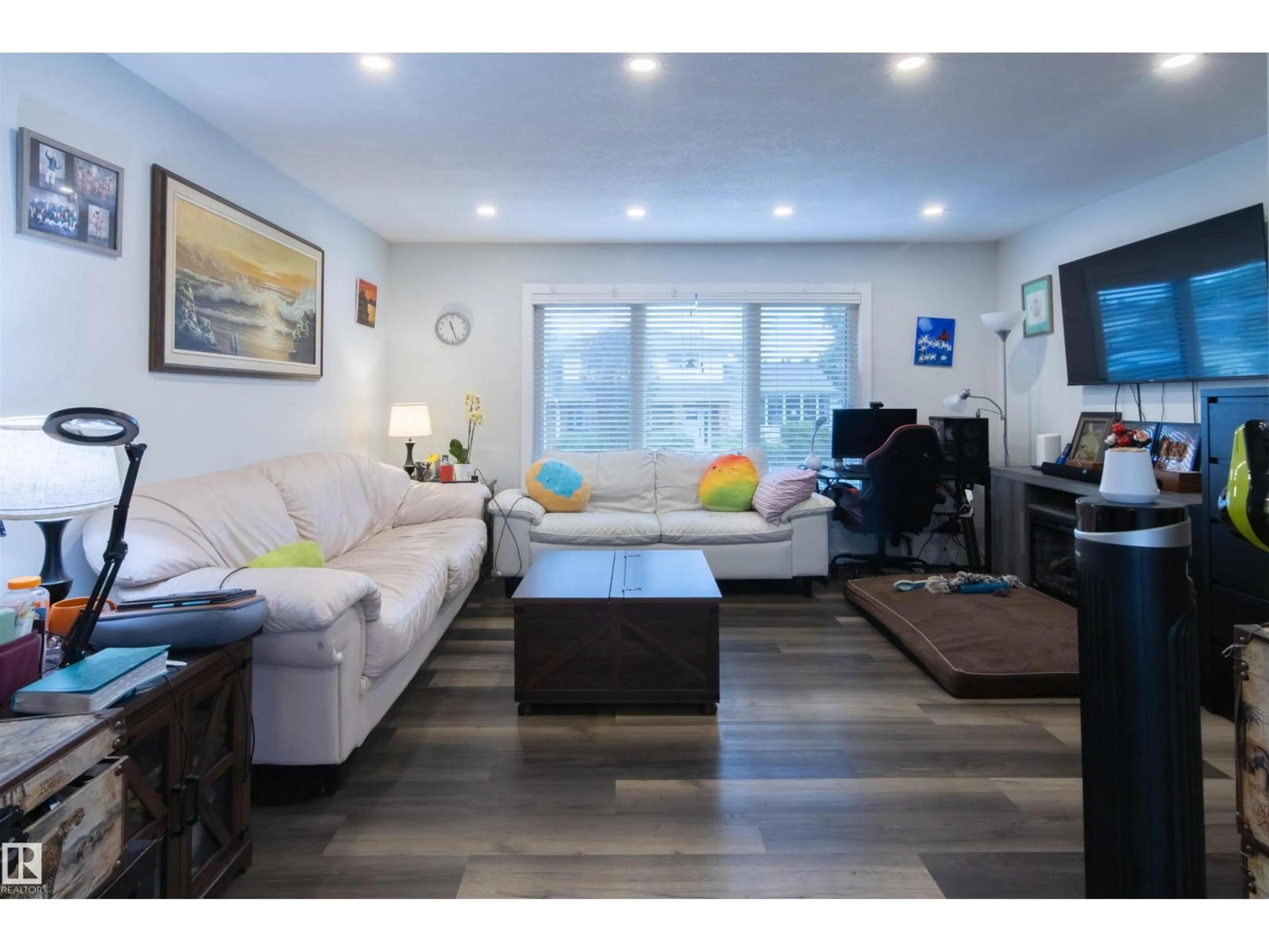 Living room with furniture, wood/laminate floor for NW - 4004 88 ST, Edmonton Alberta T6K1T7