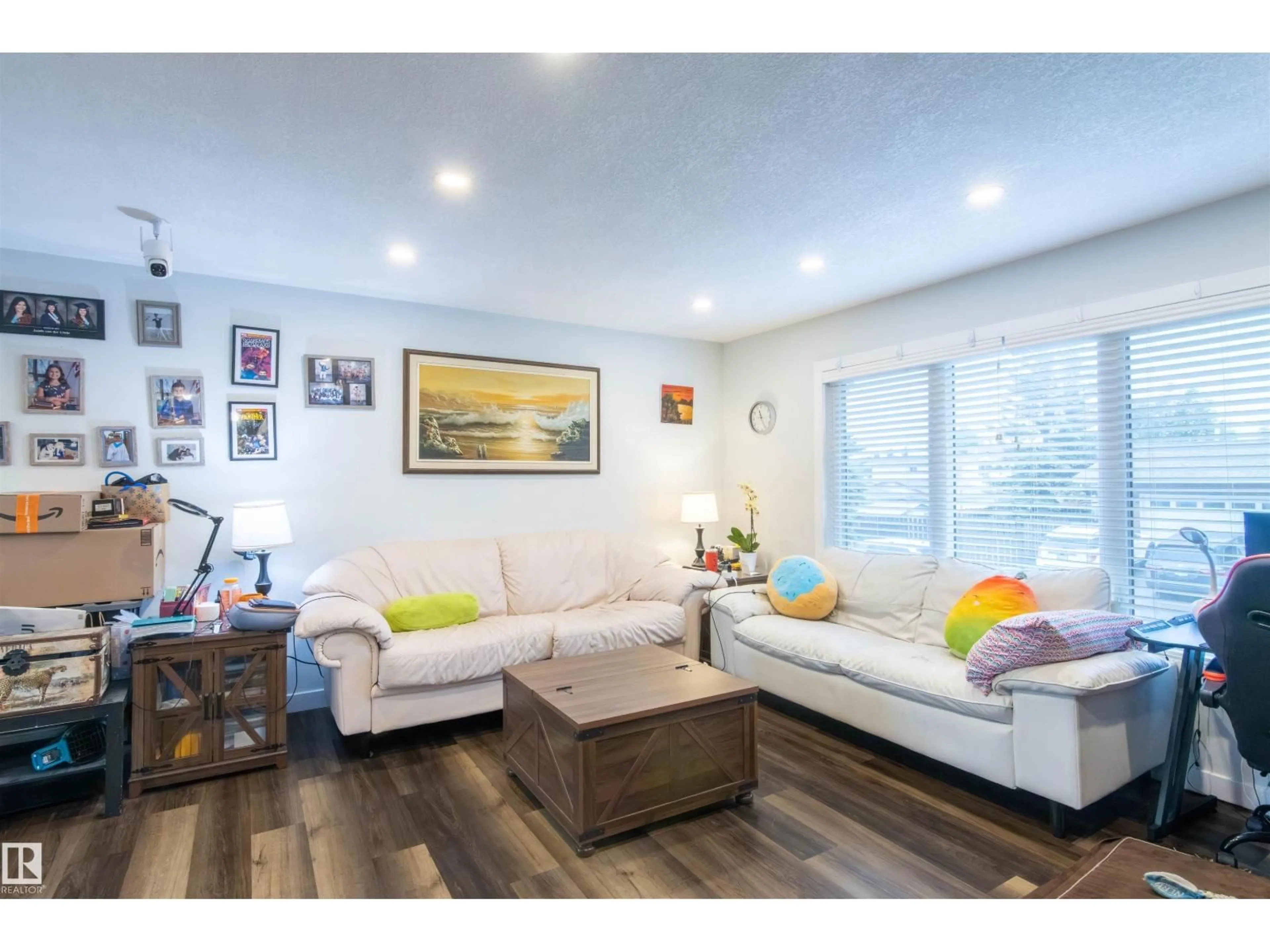 Living room with furniture, wood/laminate floor for NW - 4004 88 ST, Edmonton Alberta T6K1T7