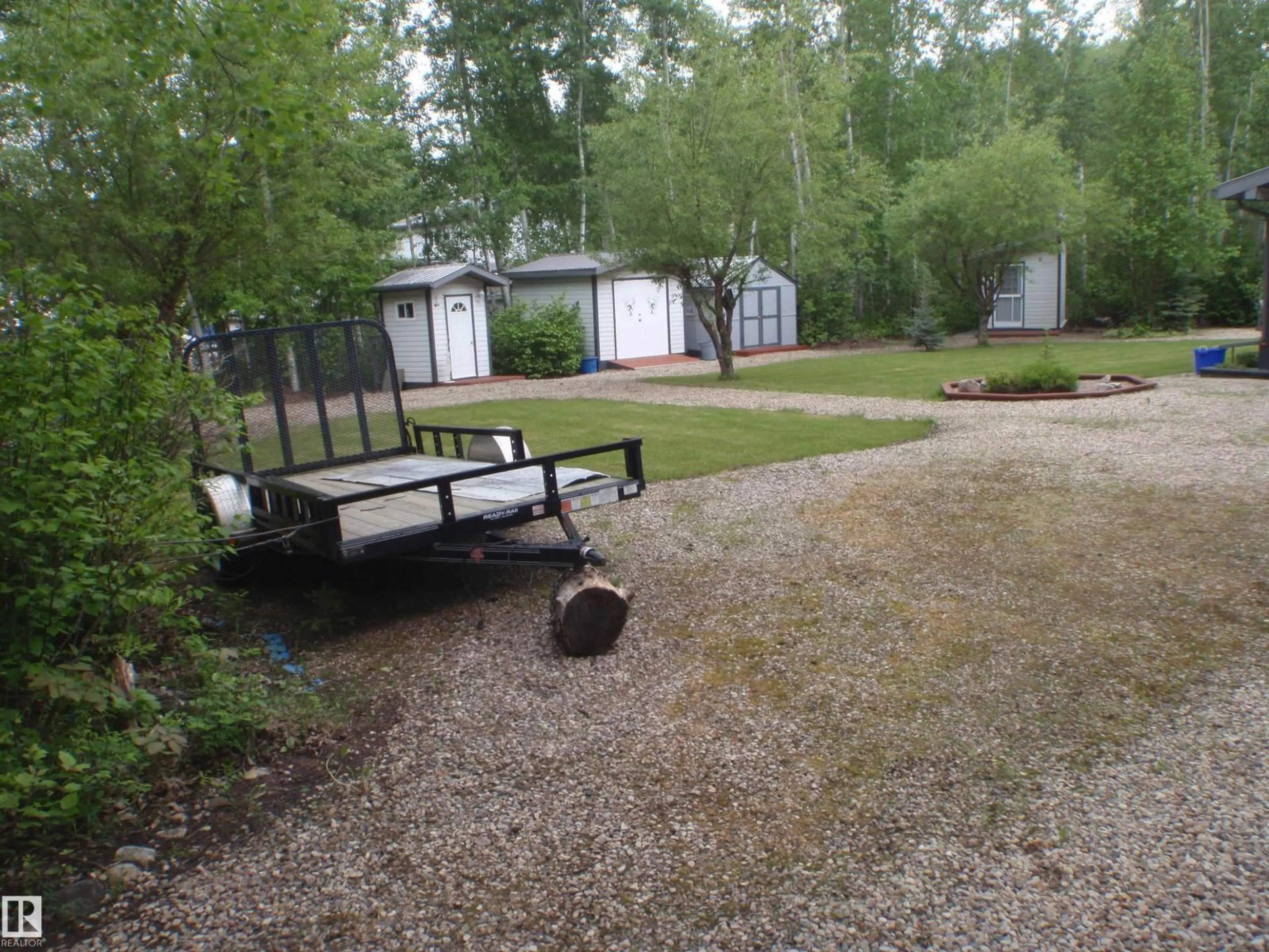 A pic from outside/outdoor area/front of a property/back of a property/a pic from drone, forest/trees view for 59316 - 59 RGE RD 54, Rural Barrhead County Alberta T7N1N3